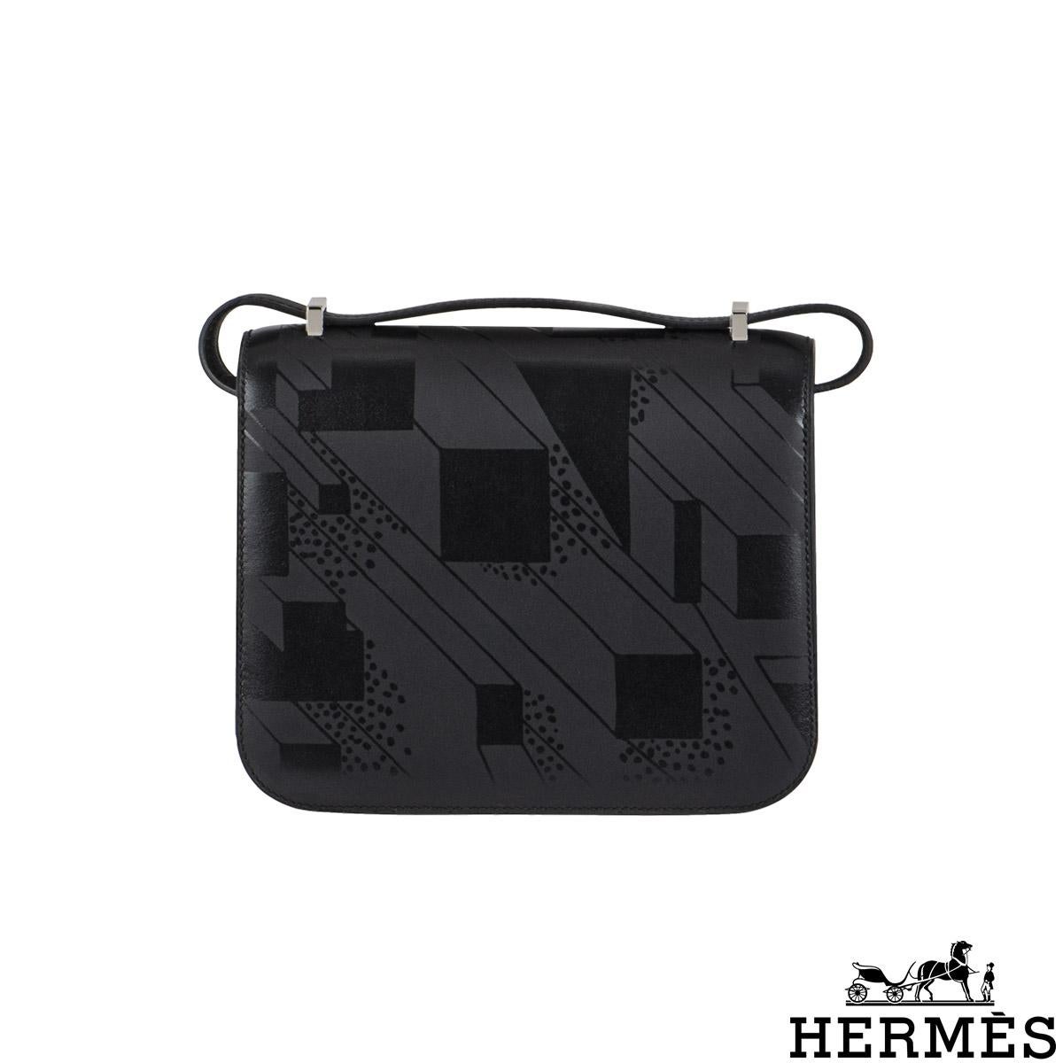 A Limited Edition Hermès Constance 18cm A Summer Night handbag. The exterior of this bag features subtle black printing on black Sombrero leather with tonal stitching, finishes with palladium hardware, a black enamel 