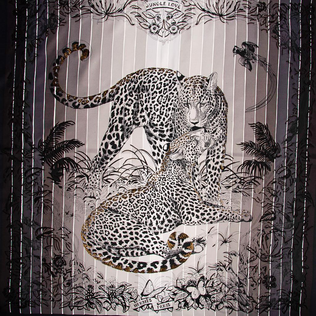 Mightychic offers a rare limited edition Hermes Jungle Love Rainbow Beaded silk scarf by Robert Dallet.  
This legendry design of love depicts 2 amorous leopards in their natural habitat.
Small hand embroidered glass beads is subtle and rich,