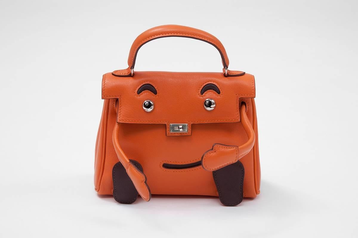 Hermes limited edition “Kelly Idole” (Kelly Doll) handbag in orange and brown Gulliver leather with Palladium hardware. Crafted on the occasion of the Millennium celebrations, this bag is an absolut collector must have. Only 50 pieces were produced.