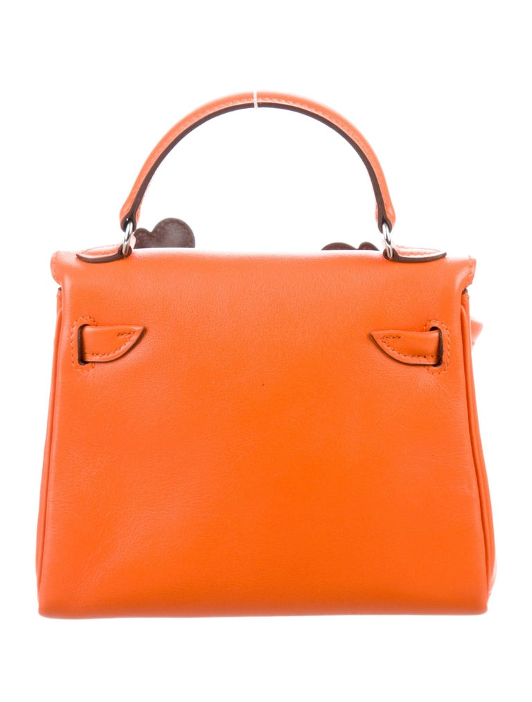 Hermes limited edition Kelly bag with a smiley face and feet! Very cute  though not something I'd carry every day! #purses #handbags #fashion #style