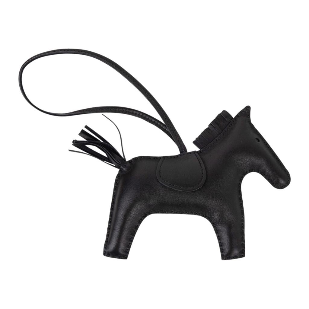 Mightychic offers a guaranteed authentic Hermes Limited Edition So Black Rodeo MM horse bag charm. 
Skin is lamb Milo.  
Signature HERMES PARIS MADE IN FRANCE is stamped under saddle.
NEW or NEVER WORN. 
Comes with signature Hermes box. 
Please see