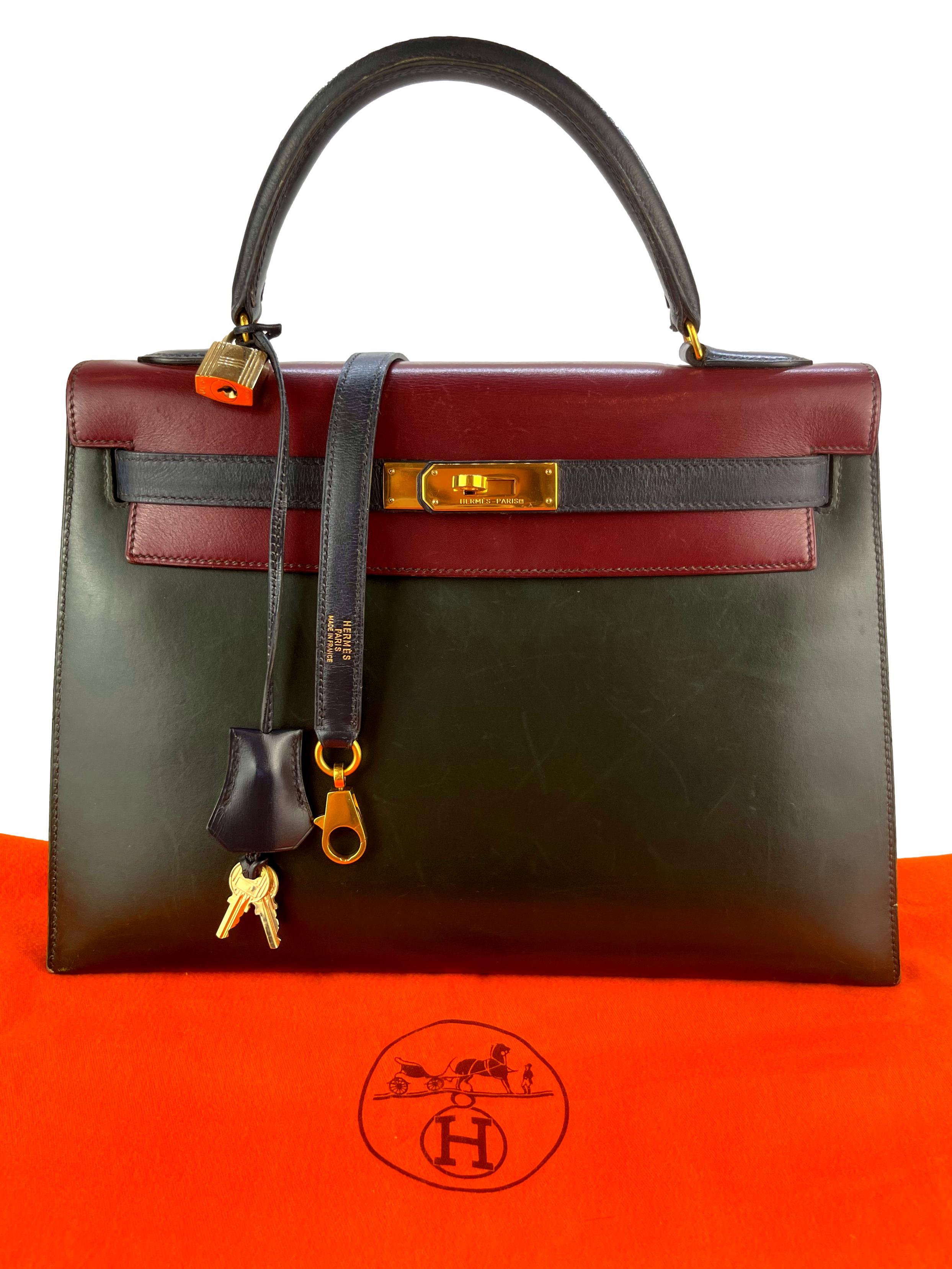 Hermès Limited Edition Vintage Tri-Color Vert Fonce, Rouge H & Indigo Box Calf Kelly Handbag with Gold Hardware 32, 1991. Originally introduced in the early 1930's as the Sac à dépêches bag, the Kelly became world renowned after Grace Kelly,
