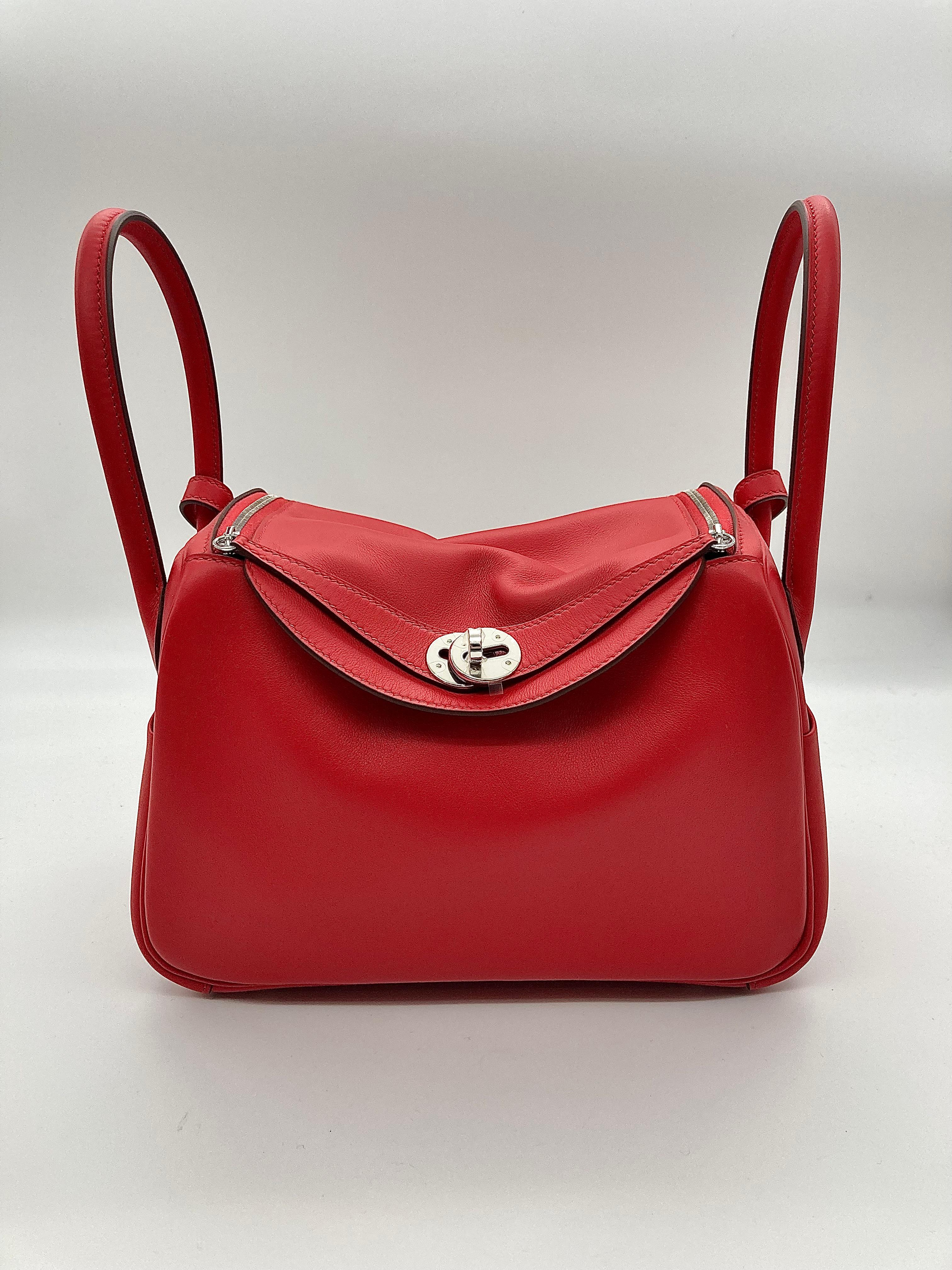 Hermes Lindy 26 Verso Swift Calfskin Rouge de Coeur / Rouge Piment Palladium Hardware

Condition: New 
Material: Calfskin Leather
Measurements: (L)10.5in. x (W)5in. x (H)6.5in. 
Hardware: Palladium plated 

Comes with full original