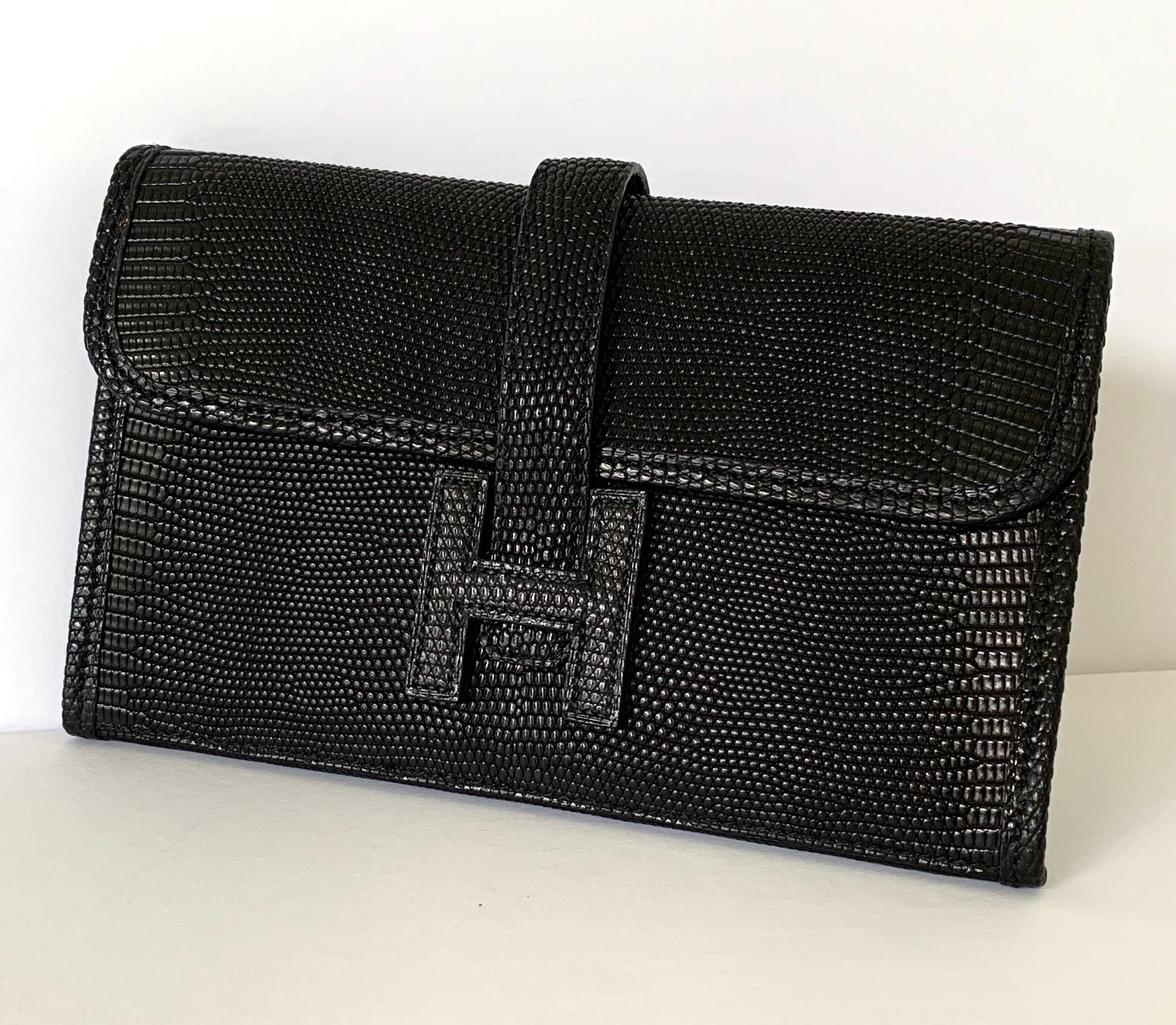 LIZARD MINI MINI JIGE CLUTCH
BLACK
SO RARE!
 

Black lizard Hermès Mini Mini Jige clutch

H Closure detail at front,
Lambskin lining
H Closure at front, pull through
Includes Hermes Box and  dust bag.

From 2014 Collection

Notice the beautiful