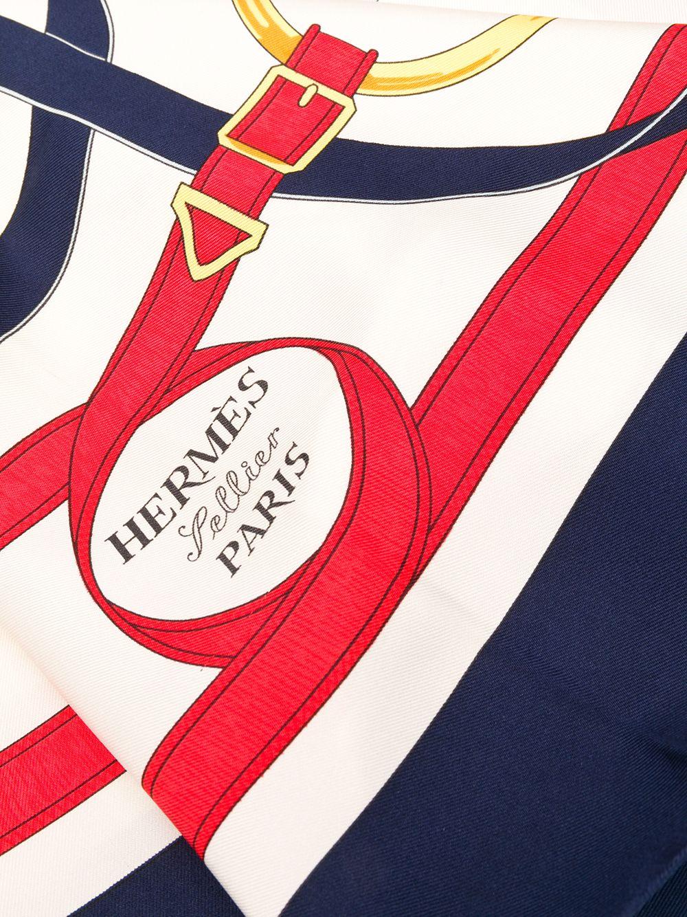 Crafted in France from the finest silk in a colourful palette of navy blue, cream, red and white, this pre-owned scarf by Hermès features a lightweight construction, a square shape and an elegant, all-over 'logo belt' motif print in alternating