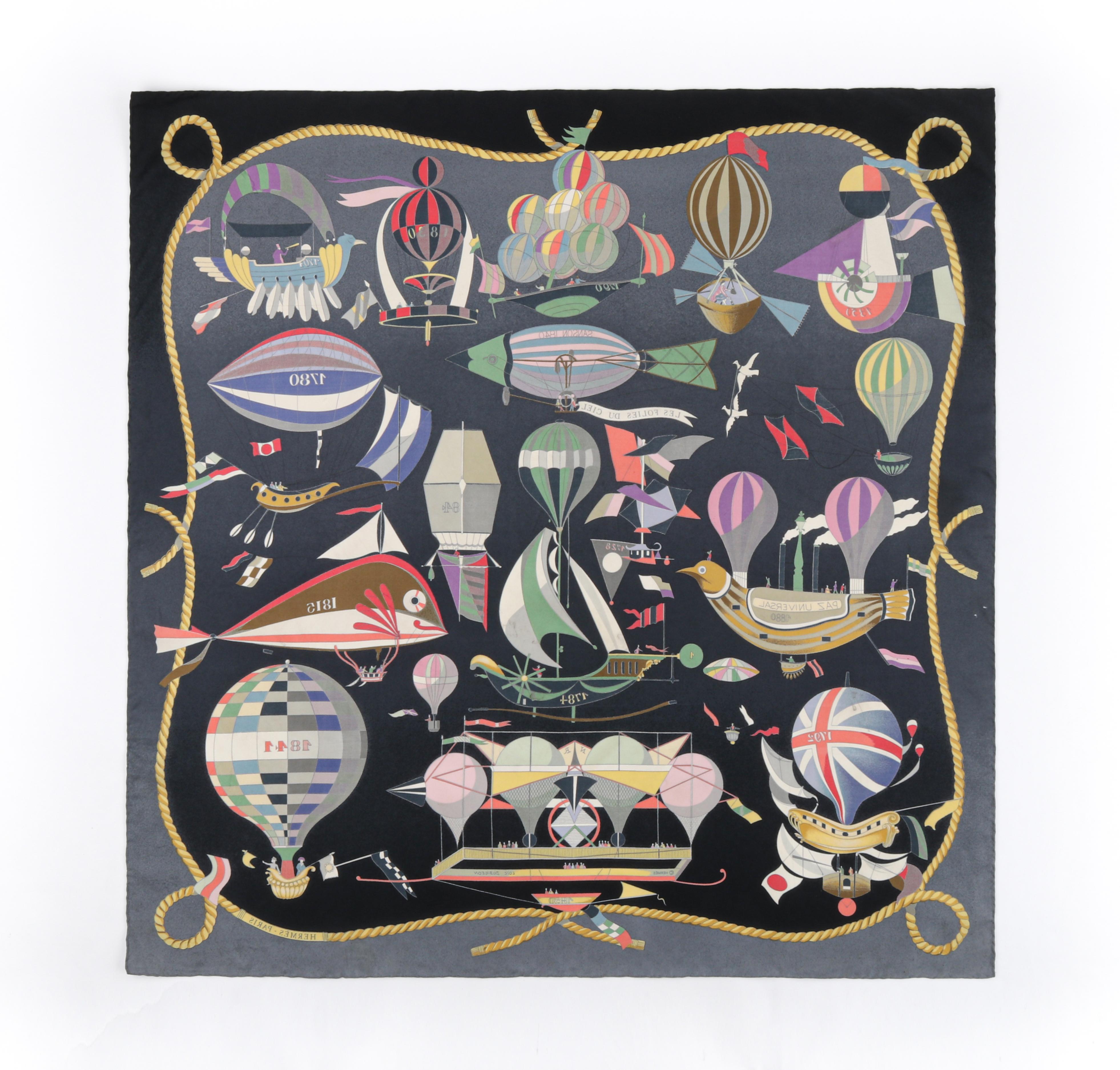 HERMES Loïc Dubigeon “Les Folies Du Ciel” Air Balloon Flying Machine Silk Scarf
 
Brand/Manufacturer: Hermes
Designer: Loic Dubigeon 
Style: Square scarf
Color(s): Shades of blue, yellow, gray, pink, green, white, purple, red, beige, black
Lined:
