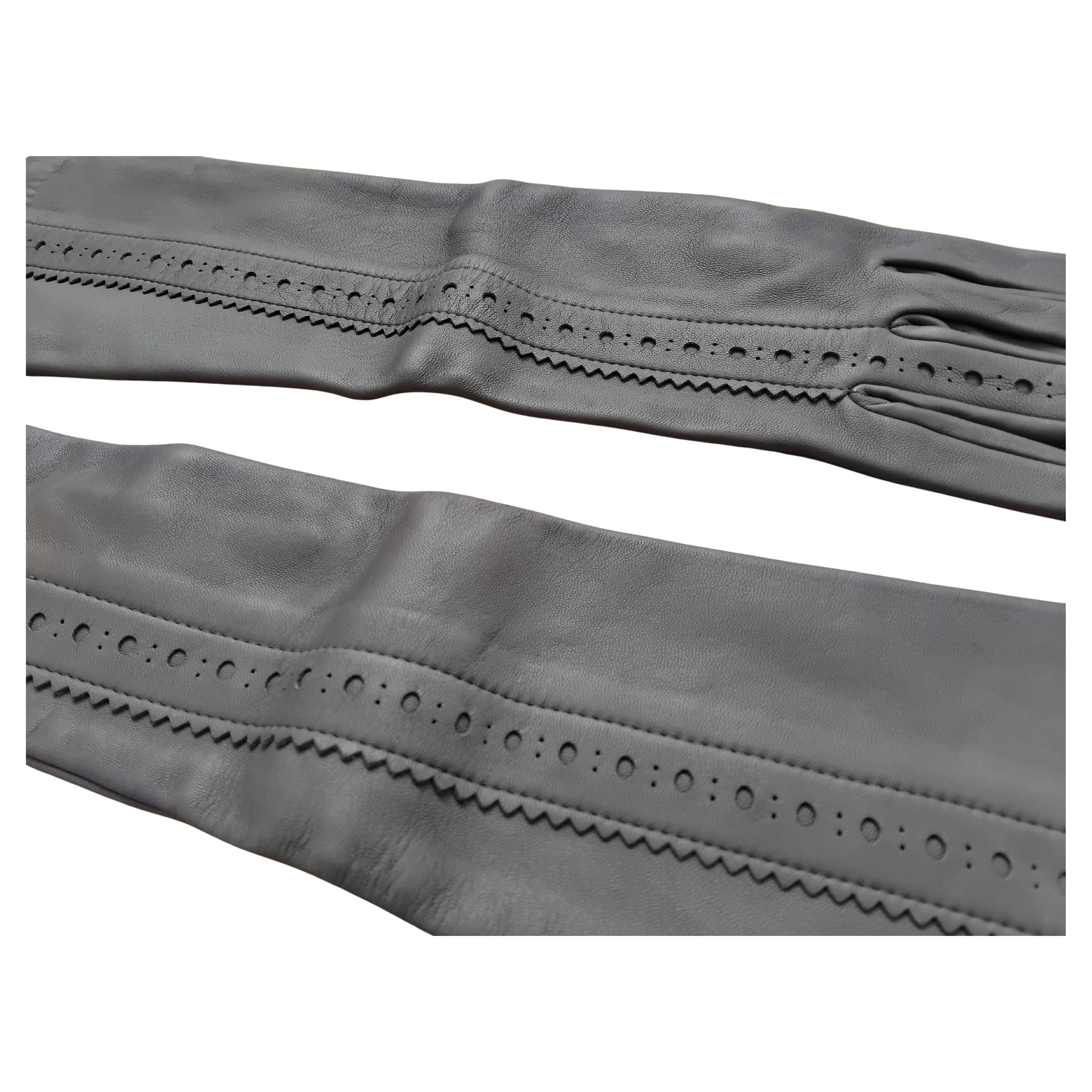 Gorgeous and Elegant Authentic Hermès Gloves

The top beautifully adorned with a band decorated with holes and nicely cut on the edge in the ghillies style

Made in France

Made of soft, smooth and supple lambskin leather 

Lined with black
