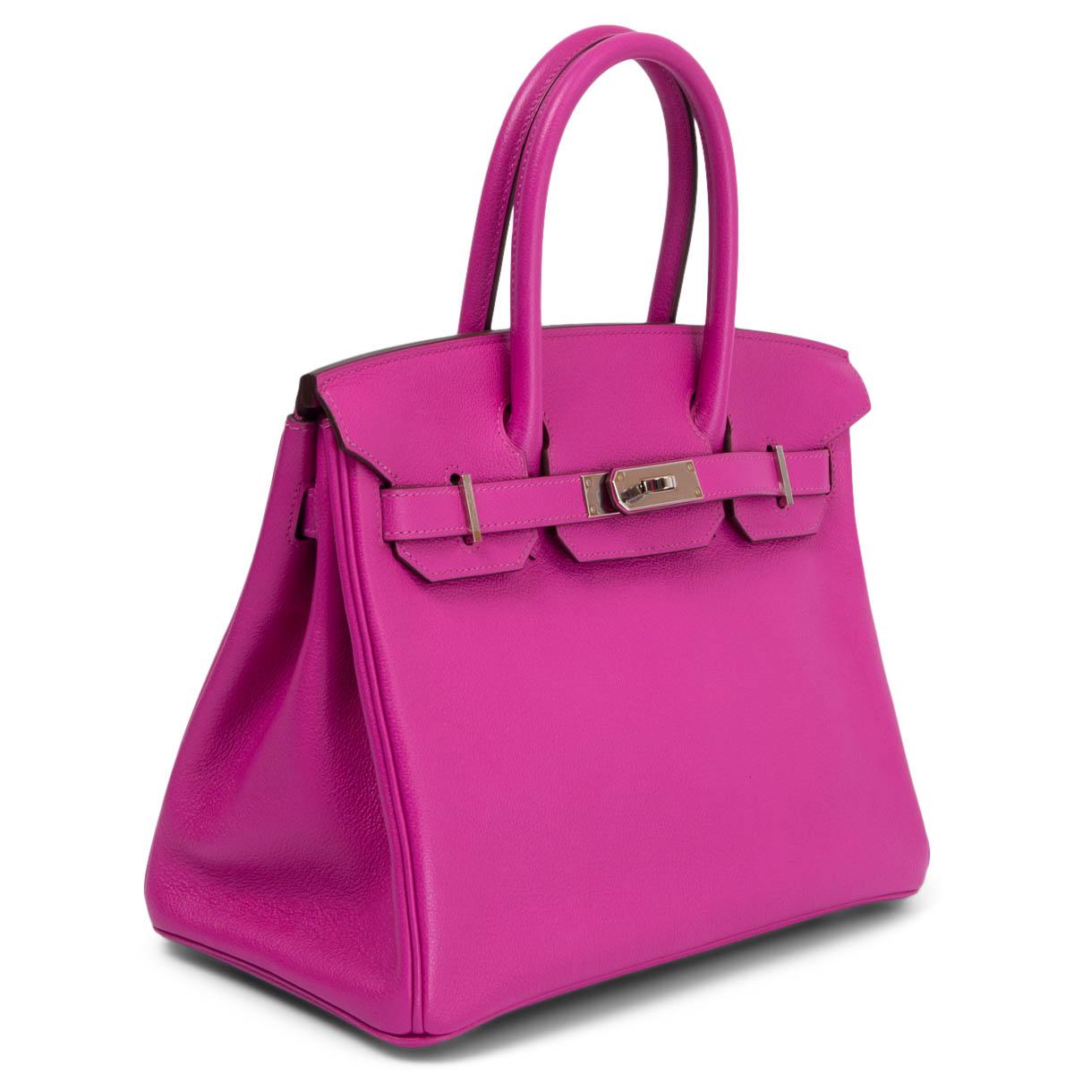 100% authentic Hermes Birkin 30 bag in Magnolia pink Taurillon Novillo leather with Palladium hardware. Lined in Chevre (goat skin) with an open pocket against the front and a zipper pocket against the back. Has been carried and is in virtually new