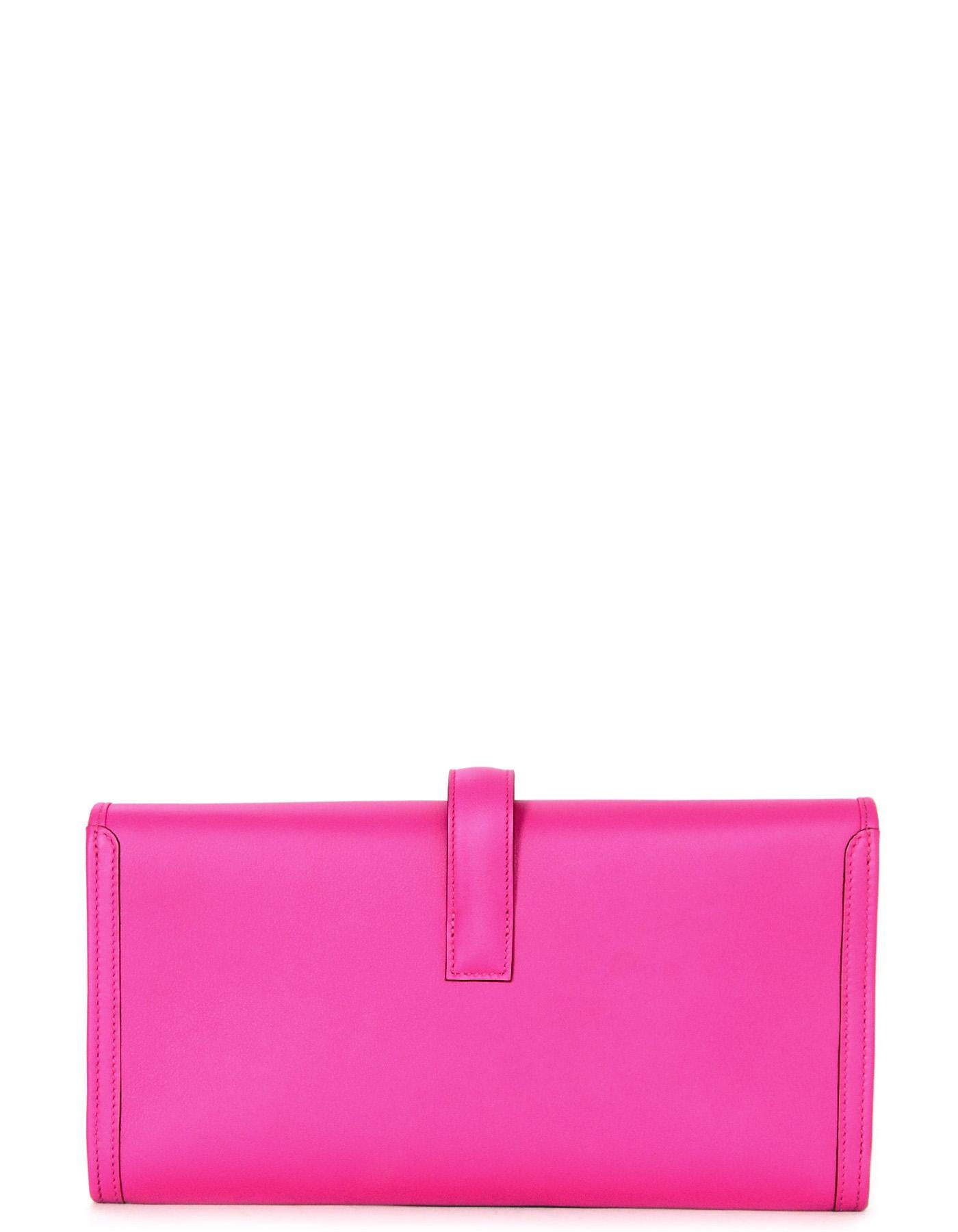Hermes Magnolia Swift Leather Jige Elan 29 Clutch Bag

Made In: France
Year of Production: 2018
Color: Magnolia pink
Hardware: None
Materials: Swift leather
Lining: Leather
Closure/opening: Flap top with strap that goes through H
Exterior Pockets: