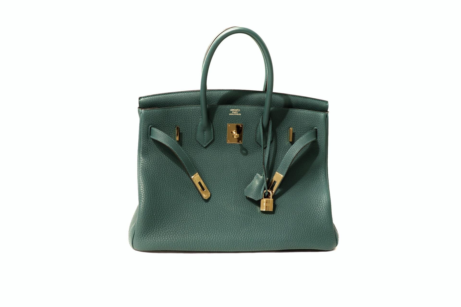 This authentic Hermès Malachite Togo 35 cm Birkin is in very good condition.    Hand stitched by skilled craftsmen, wait lists of a year or more are common for the Hermès Birkin. They are considered the ultimate in luxury fashion. Malachite, like