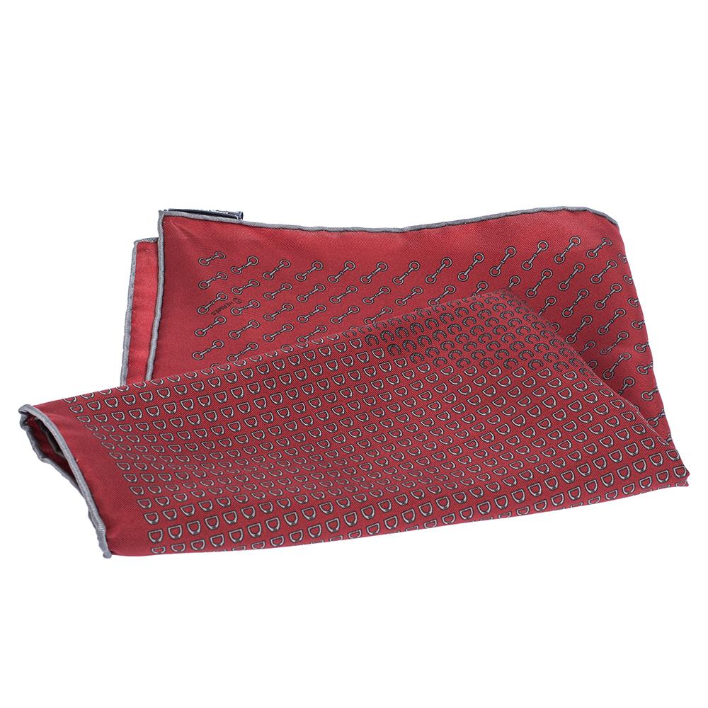 Speak luxury through your choice of accessories with this pocket square from Hermes. It has been cut from silk and designed with an amazing print in a maroon shade. It is soft to touch and perfect with your suits.

Includes:Original Box