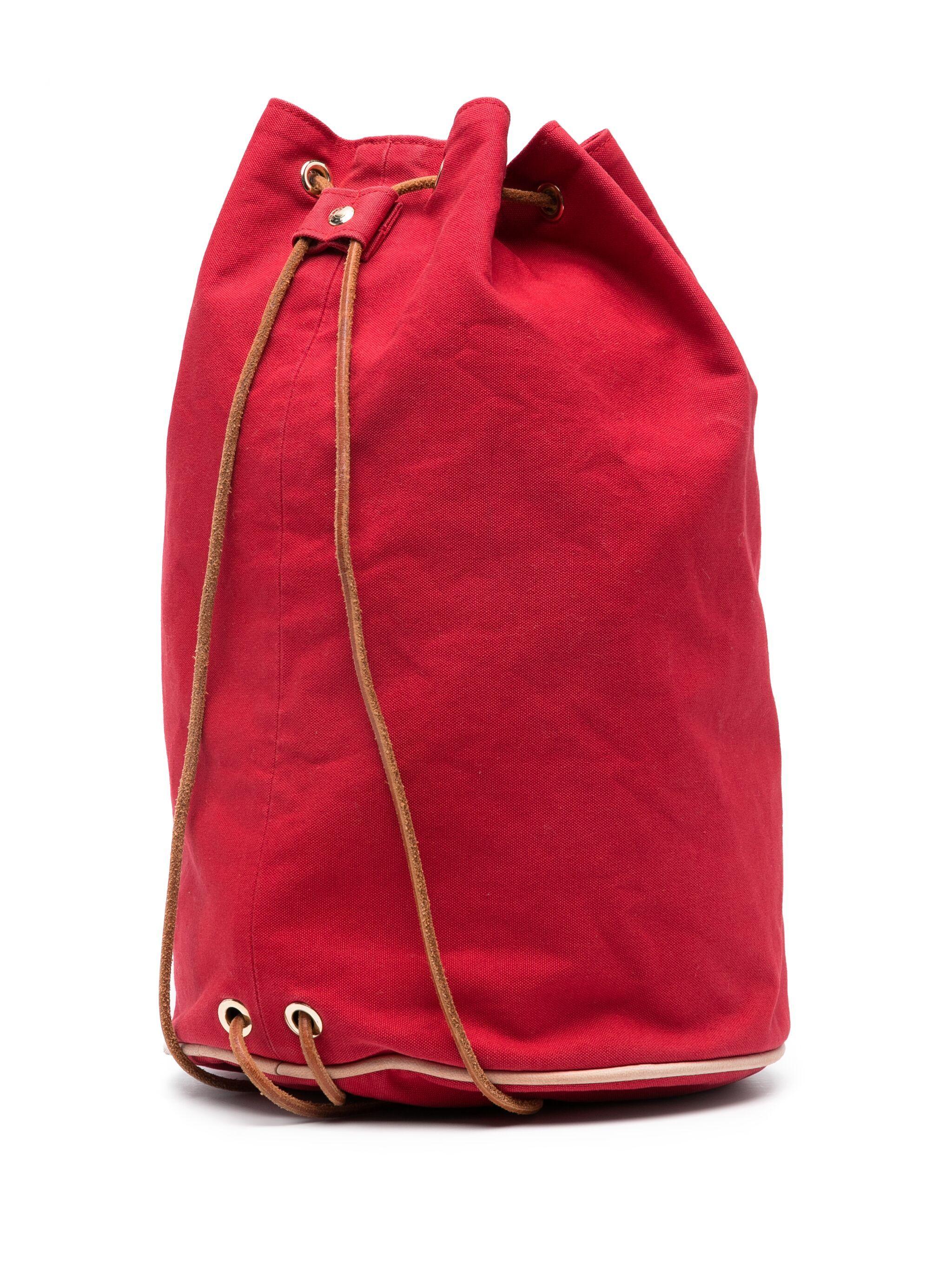 Hermes 1990s red Matelot-Marin cotton backpack featuring front embroidered signature H logo, metal eyelet detailing, adjustable leather shoulder straps, top drawstring fastening, main compartment.
Circa 1990s  100%cotton
In good vintage condition .