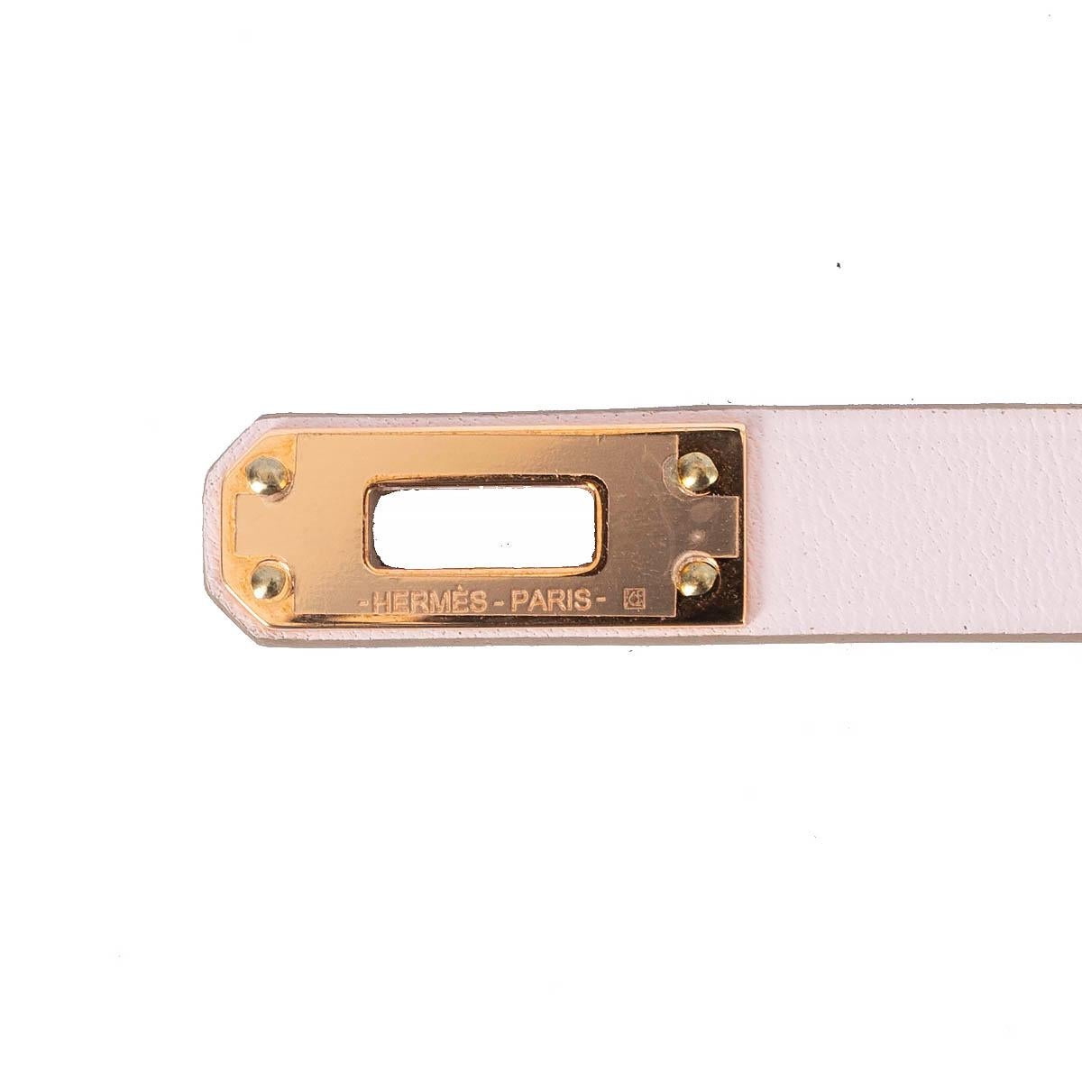 100% authentic Hermès Mini Kelly Double Tour bracelet in Mauve Pale pink Veau Swift leather with rose gold-plated mini Kelly turnlock closure. Brand new with box.

Measurements
Model	H081182CD09T2
Tag Size	T2
Width	1cm (0.4in)
Length	35cm