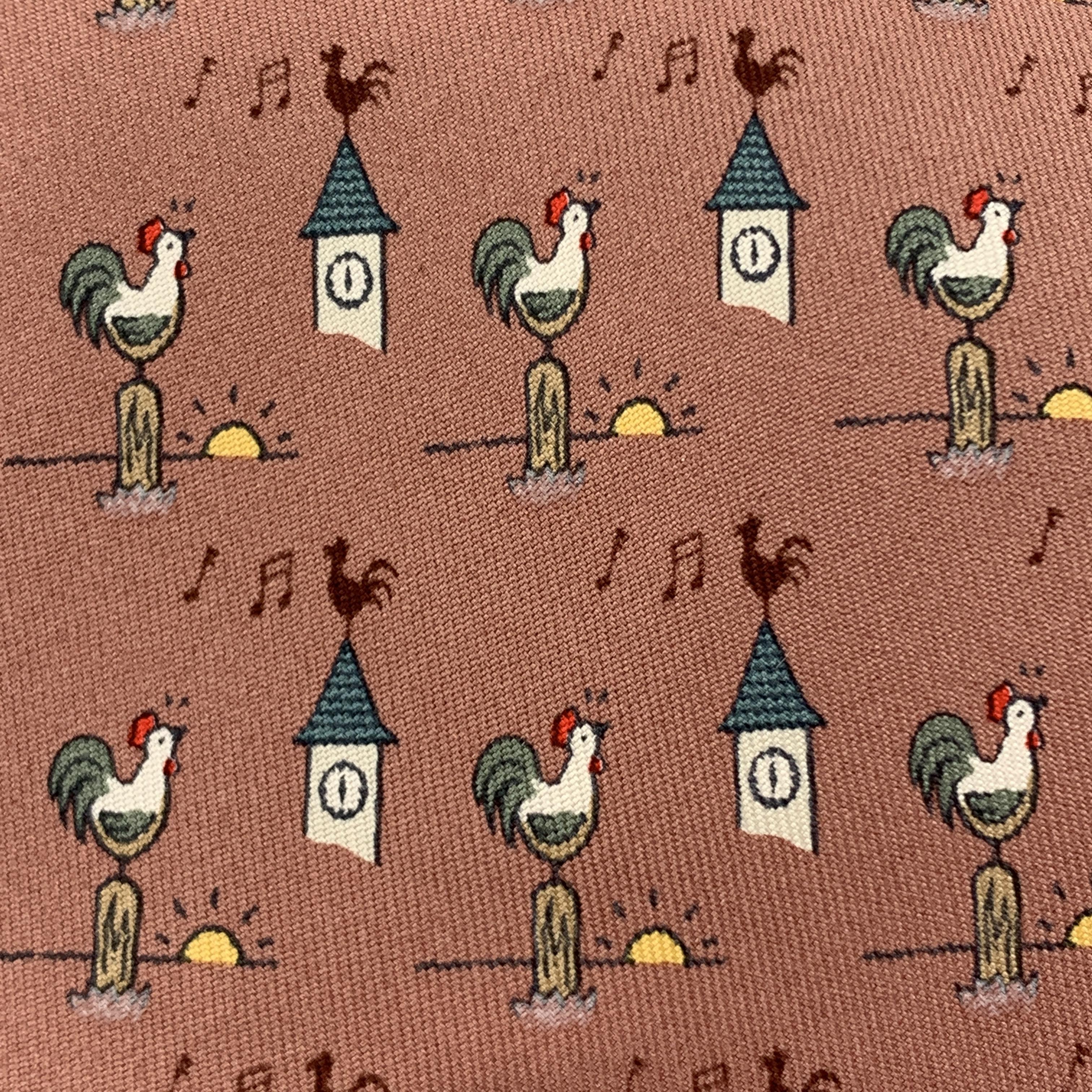 HERMES necktie comes in mauve pink silk twill with all over sunrise roosters print. Made in France.

Excellent Pre-Owned Condition.

Width: 3.75 in.
 