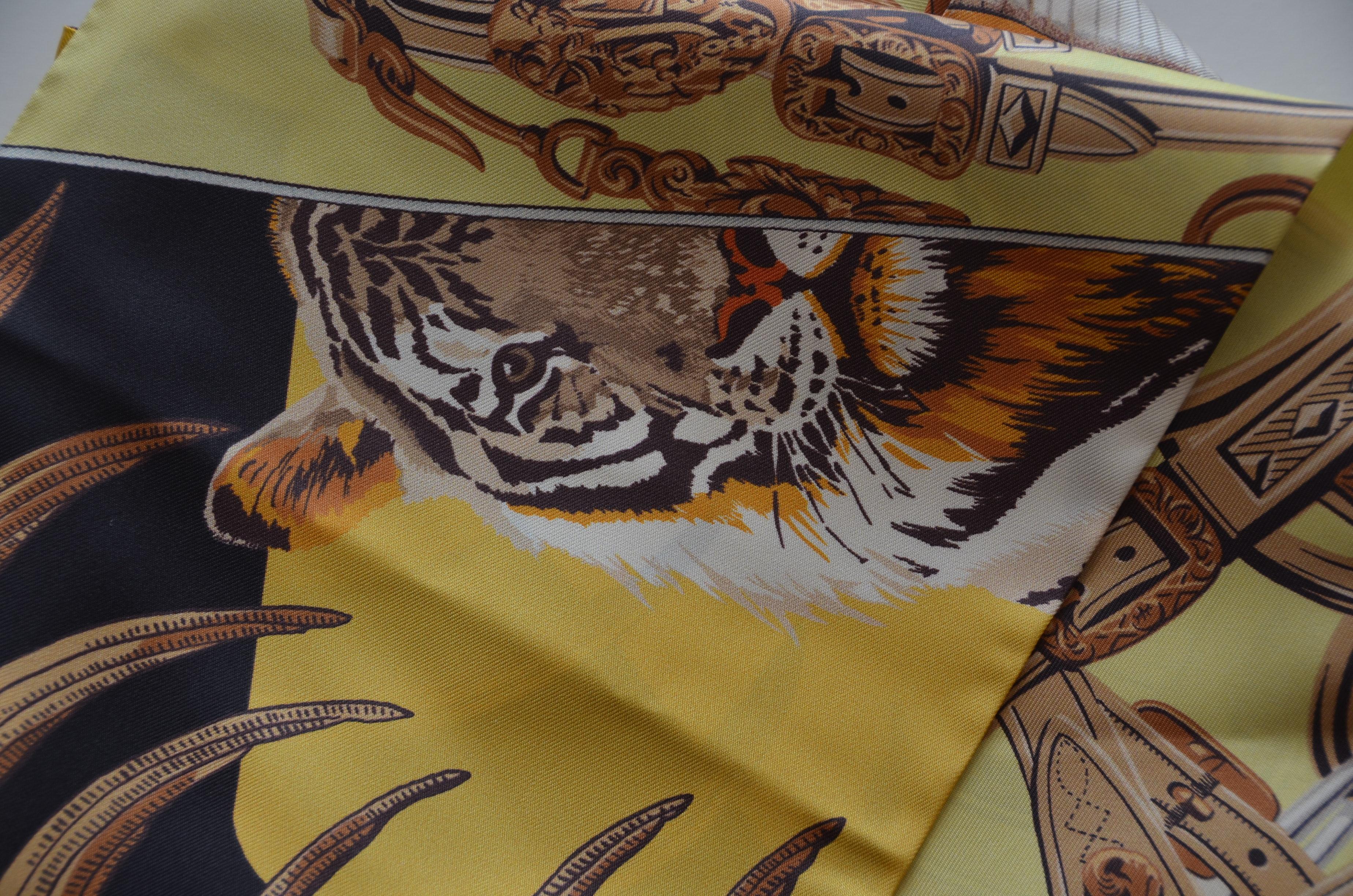 HERMES Maxi Twilly  with tiger, horses and Indian print 
100% Silk    
Size 20 X 220 CM       
NEW with tags and box
Colors Jaune/Noir 
Made in France 

FINAL SALE

