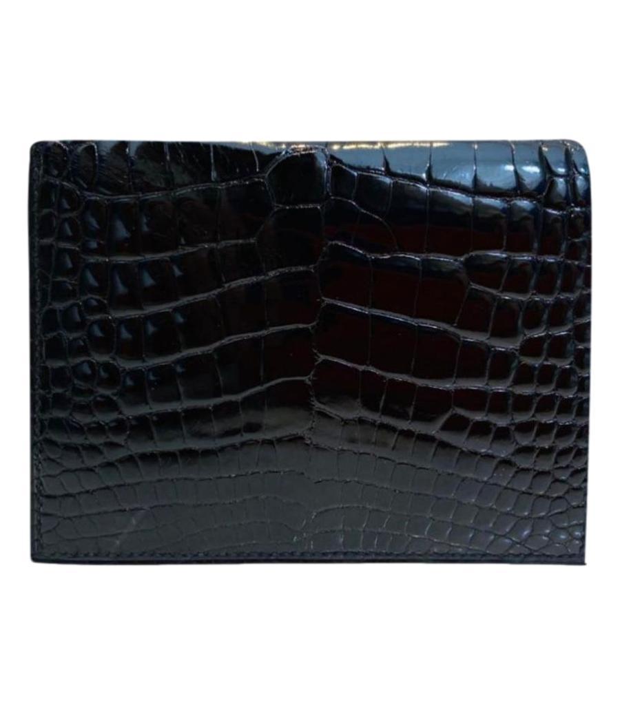 Hermes MC2 Shiny Alligator Bi Fold Wallet

Black, shiny Alligator Mississippiensis skin wallet.

Three card compartments to the each side and a double note compartments.

Date code is N in a square

Size - Height 11.5 cm, Width 9 cm

Condition -