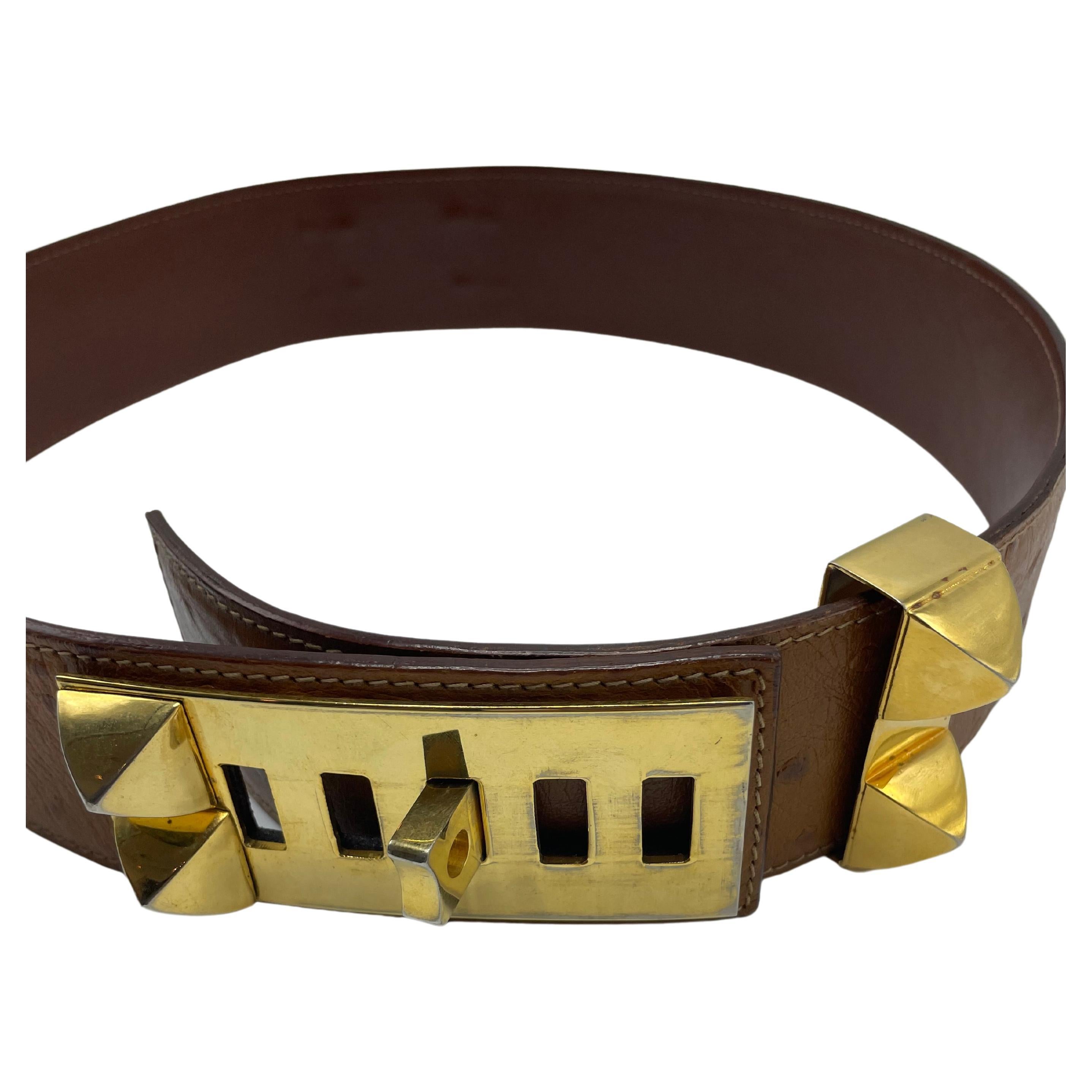 Hermès Medor Belt Ostrich. Medor belt in brown ostrich and gold hardware. In good condition, no stain, no smell. This stunning belt has five buckles making the size adjustable. Made in France. 