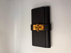 Hermes Medor black leather clutch bag