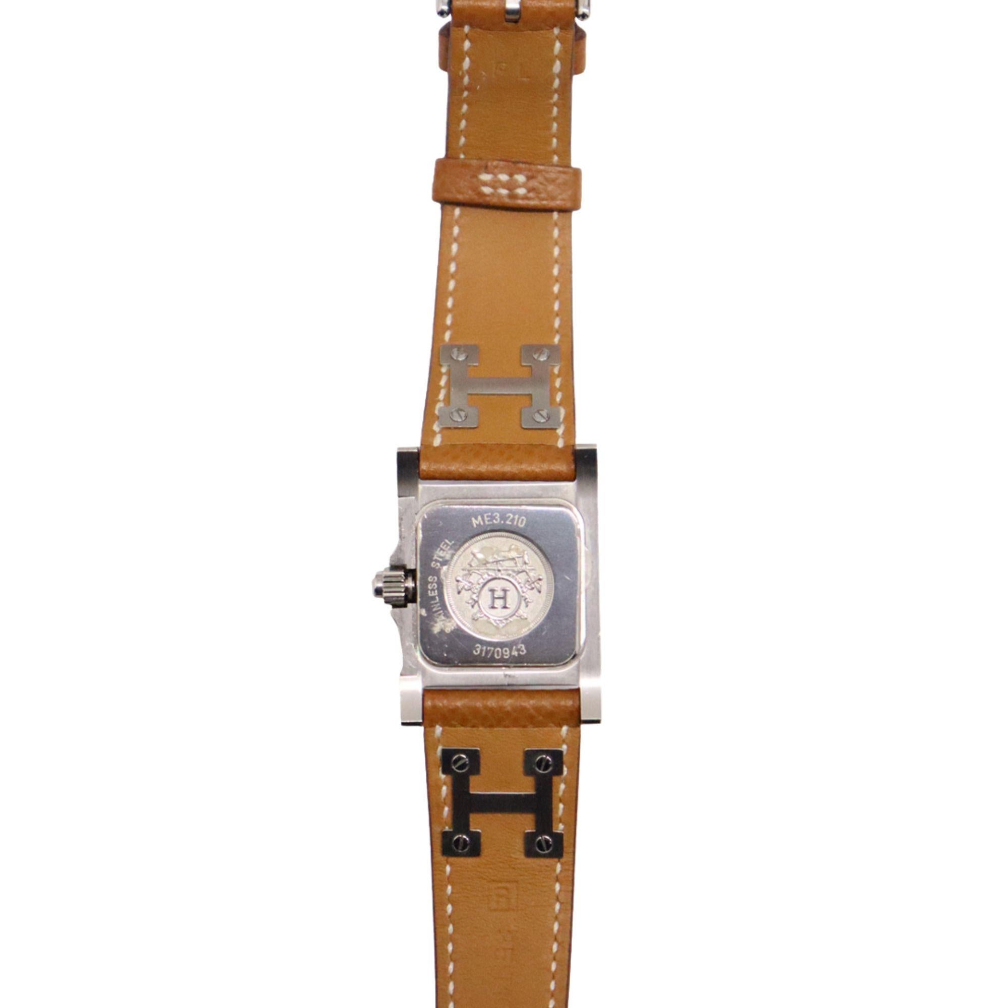 Hermes Medor Steel Watch in Gold Chestnut, Features:

- Steel case
- Anti-glare sapphire crystal
- Opaline silvered dial
- Quartz movement, Swiss Made
- Hour, minute functions
- Water-resistant to 3 bar. 
- Long single tour strap in gold Epsom