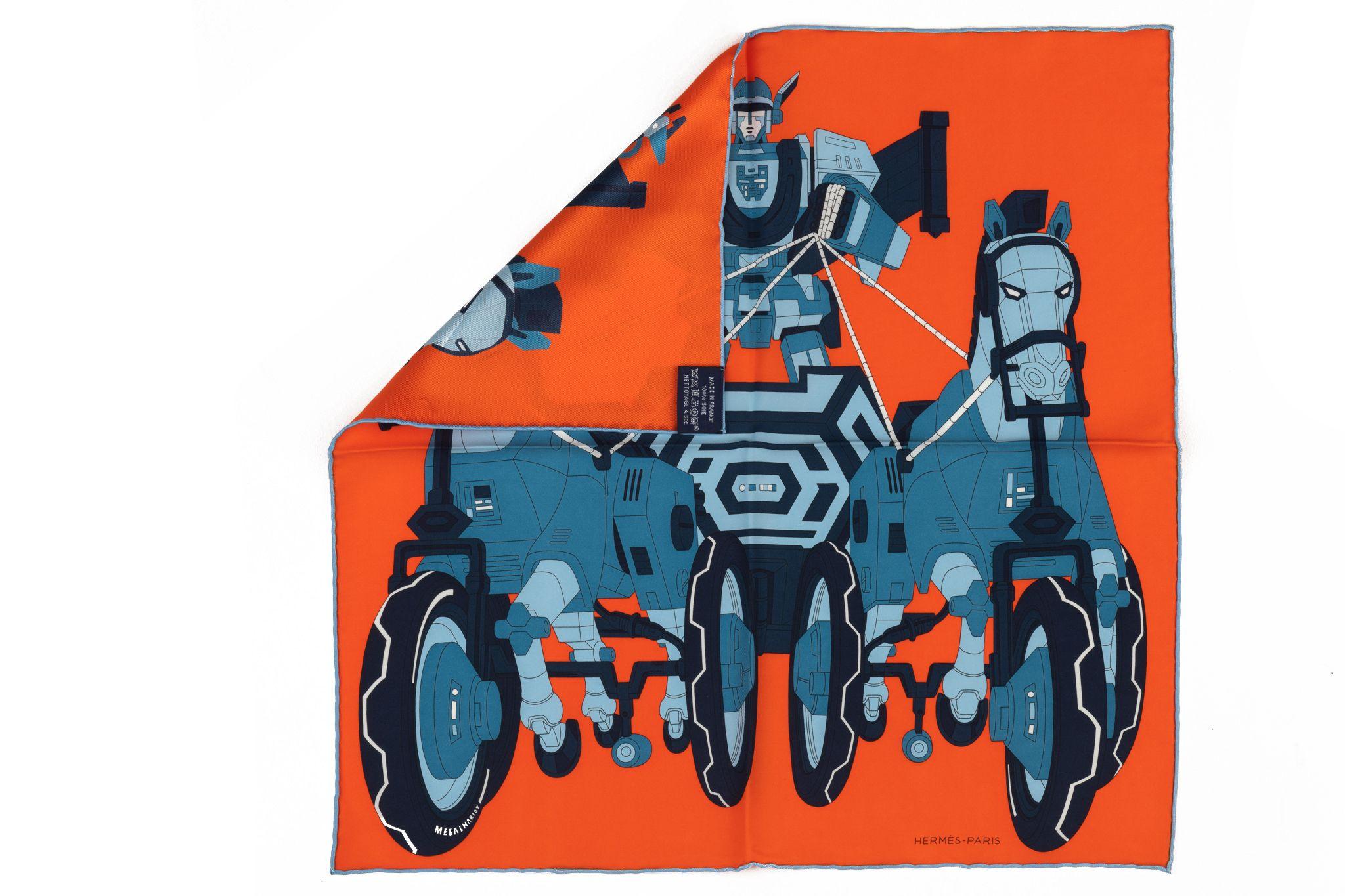 Hermès Mega Chariot par Daisuke Nomura Foulard. Nomura s'est inspiré d'un tricycle à cheval pour enfants de la collection Emile Hermes. Il montre le dieu Hermès qui aurait pris le char d'Apollo sans sa permission. Transformé en robot, le tricycle