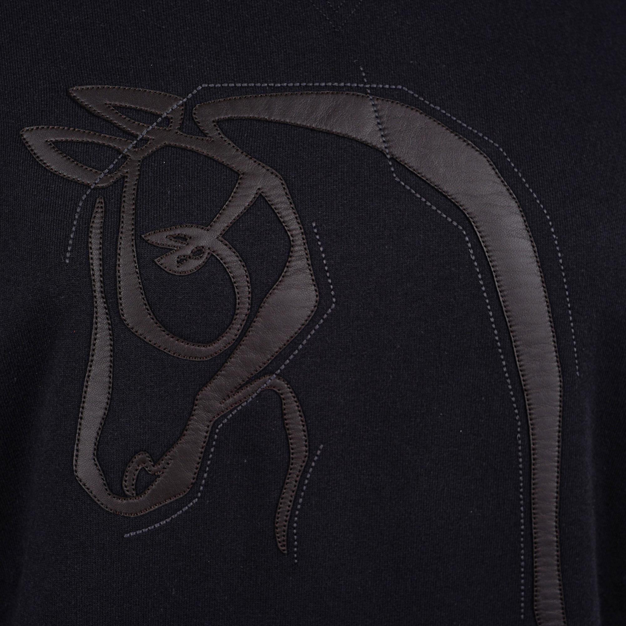 Mightychic offers an Hermes Crewneck Sweater (sweatshirt) with Leather Detail.
Black Cotton with Black Cheval au Trait lambskin patch in front.
Ribbed cuffs and hip.
Fabric is cotton.
NEW or NEVER WORN.
final sale

SIZE: M

SWEATER MEASURES:
LENGTH