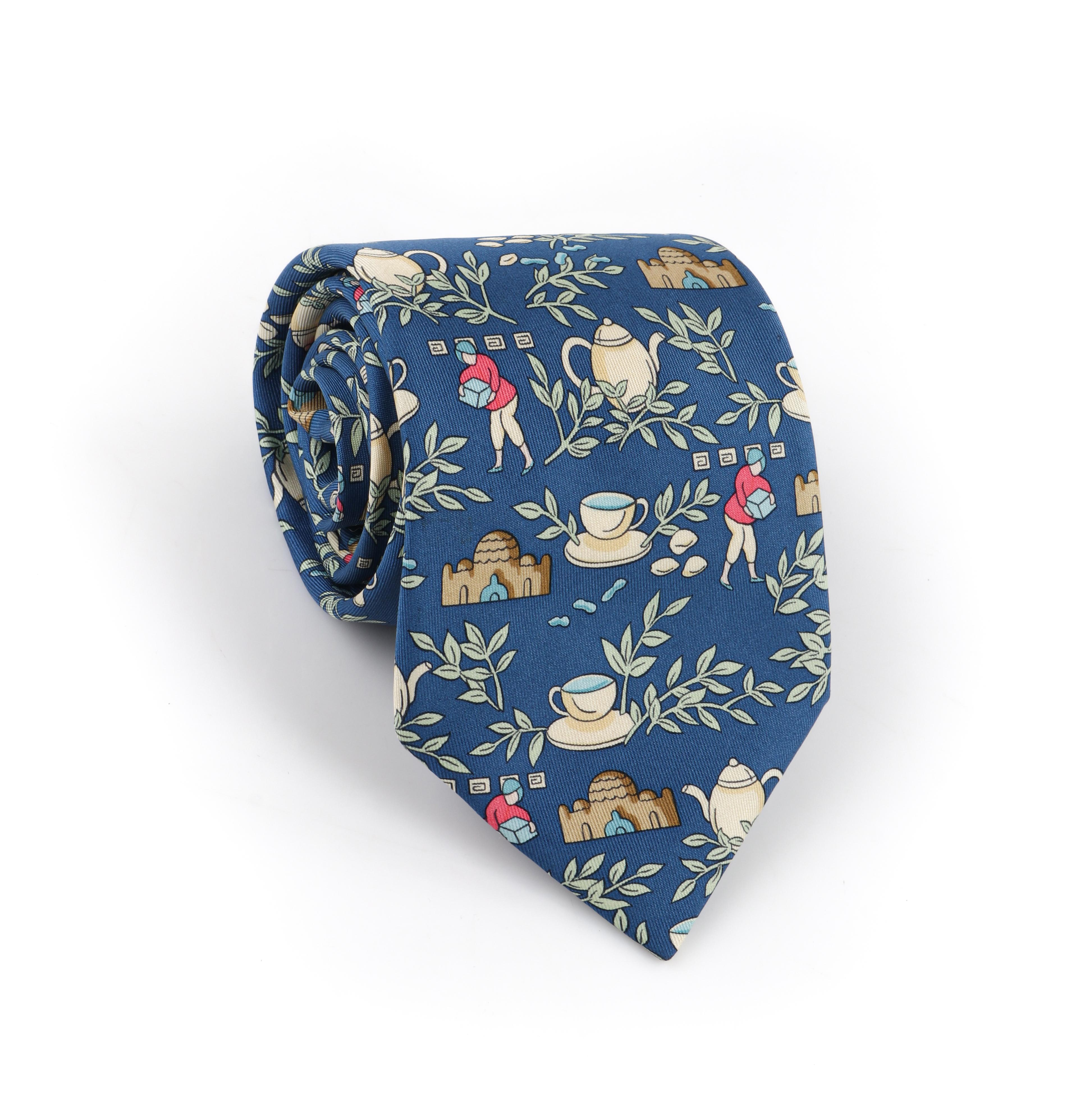 HERMES Men's Blue Multicolor Tea Set & Tea Leaf Branch Silk Necktie Tie 7501 IA
 
Brand/Manufacturer: Hermes
Style: 5-Fold necktie
Color(s): Shades of blue, green, cream, beige, tan, pink
Lined: Yes
Marked Fabric Content: “100% Silk”  
Additional