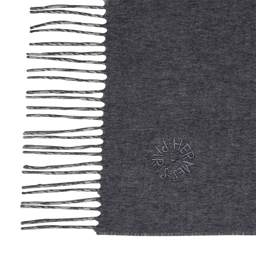 Mightychic offers an Hermes Cashmere reversible scarf with fringed edges.
Beautiful neutral Grey reverses to Winter White.
Grey and White fringe at each end.
Subtle tone on tone Hermes Paris embroidered on one corner.
NEW or NEVER WORN.
final