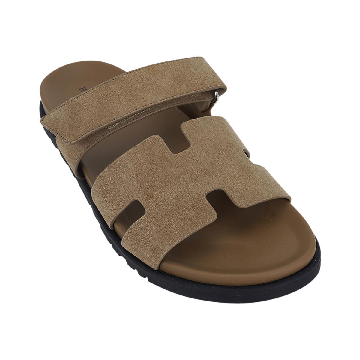 Mightychic offers a pair of limited edition Hermes Men's Chypre sandal featured in Tan.
Beautiful fawn tan hue suede with matching anatomical insole and H embossed Black rubber sole.
Strap across foot is adjustable with velcro closure.
Comes with