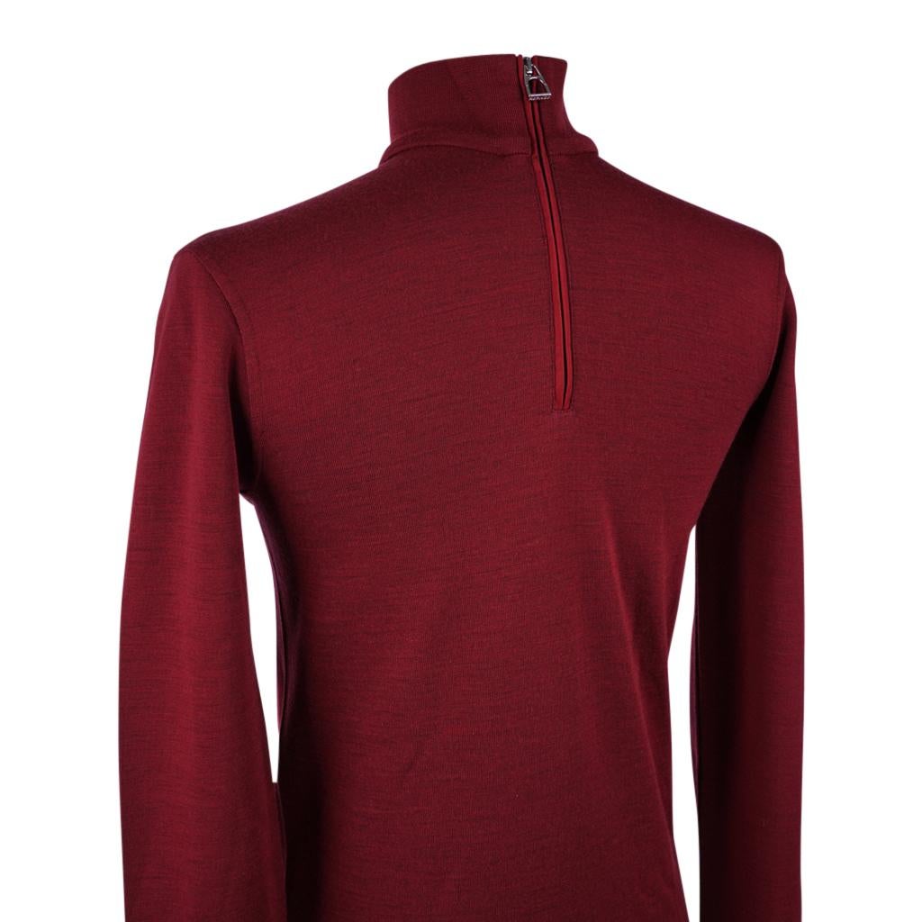 Mightychic offers a guaranteed authentic Hermes Men's Cocoon Base Layer Top in Rouge.
Long sleeved extra thin Merino wool blend top.
Part of the Equestrian collection, the cut and fabric promote freedom of movement.
Polo neck collar and zip with