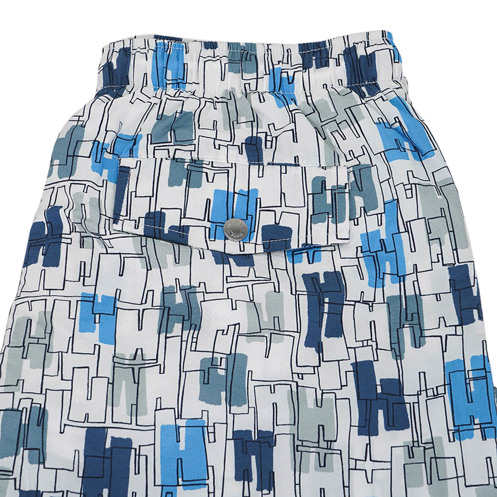 Hermes long swim trunks featured in Coups de Goua'H print.
In Bleu colorway.
H design with a gouache technique where the colours seem to be be under water.
Trunks have an elastic waistband with drawstring for adjustment.
2 side pockets and 1 rear