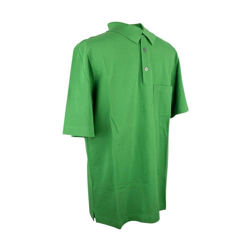 Guaranteed authentic Hermes Vert Vif polo shirt with embroidered H on pocket.
3 mother of pearl buttons.
Short sleeve shirt. 
Classic style and effortless elegance.
Fabric is cotton. 
NEW or NEVER WORN 
final sale

SIZE  L

TOP MEASURES:
LENGTH 