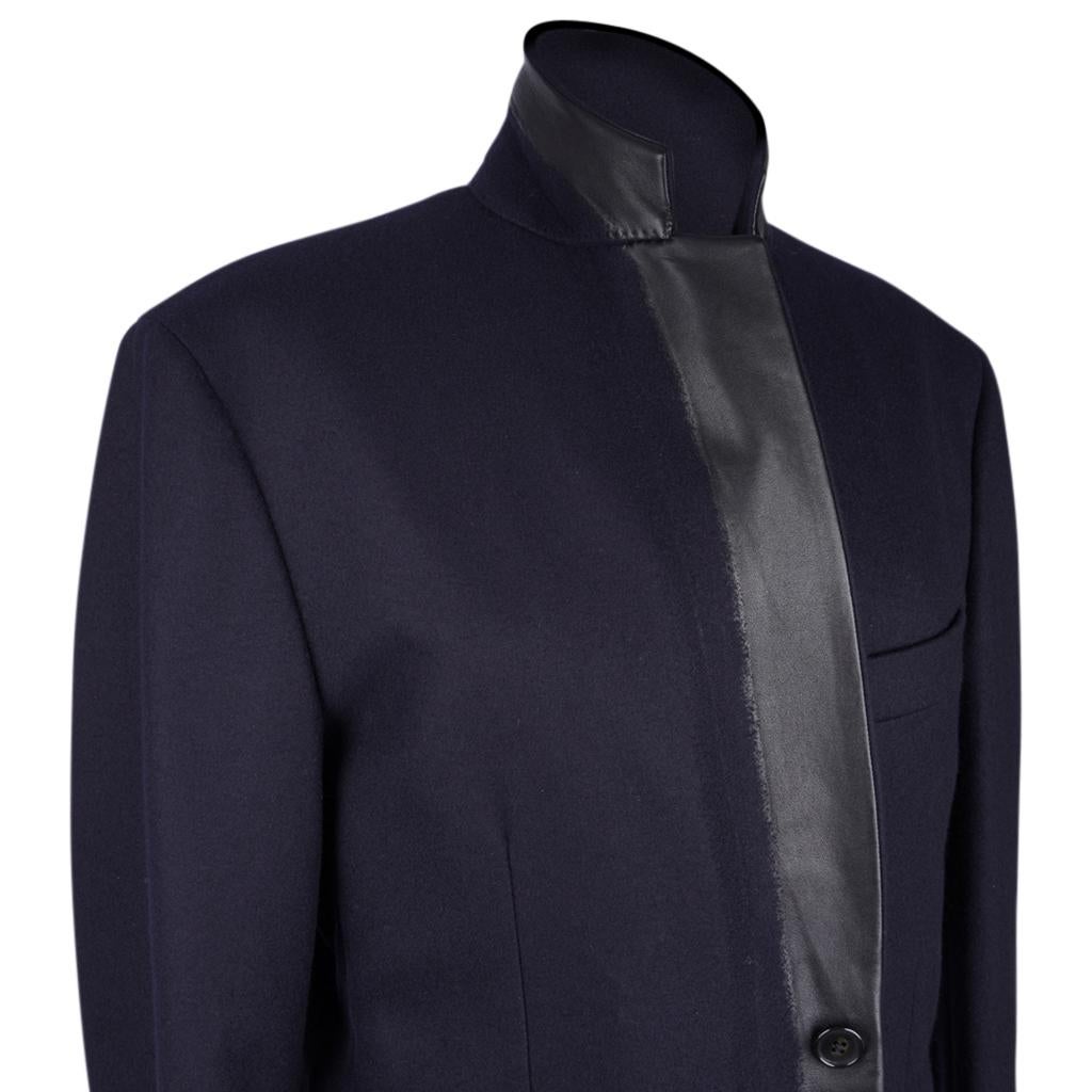 Mightychic offers a guaranteed authentic Hermes Men's limited edition, very rare, Fantome Blazer featured in Bleu Marine cashmere and Black leather.
Remarkable leather trim along front of jacket and cuffs. The leather is 'infused' into the winter