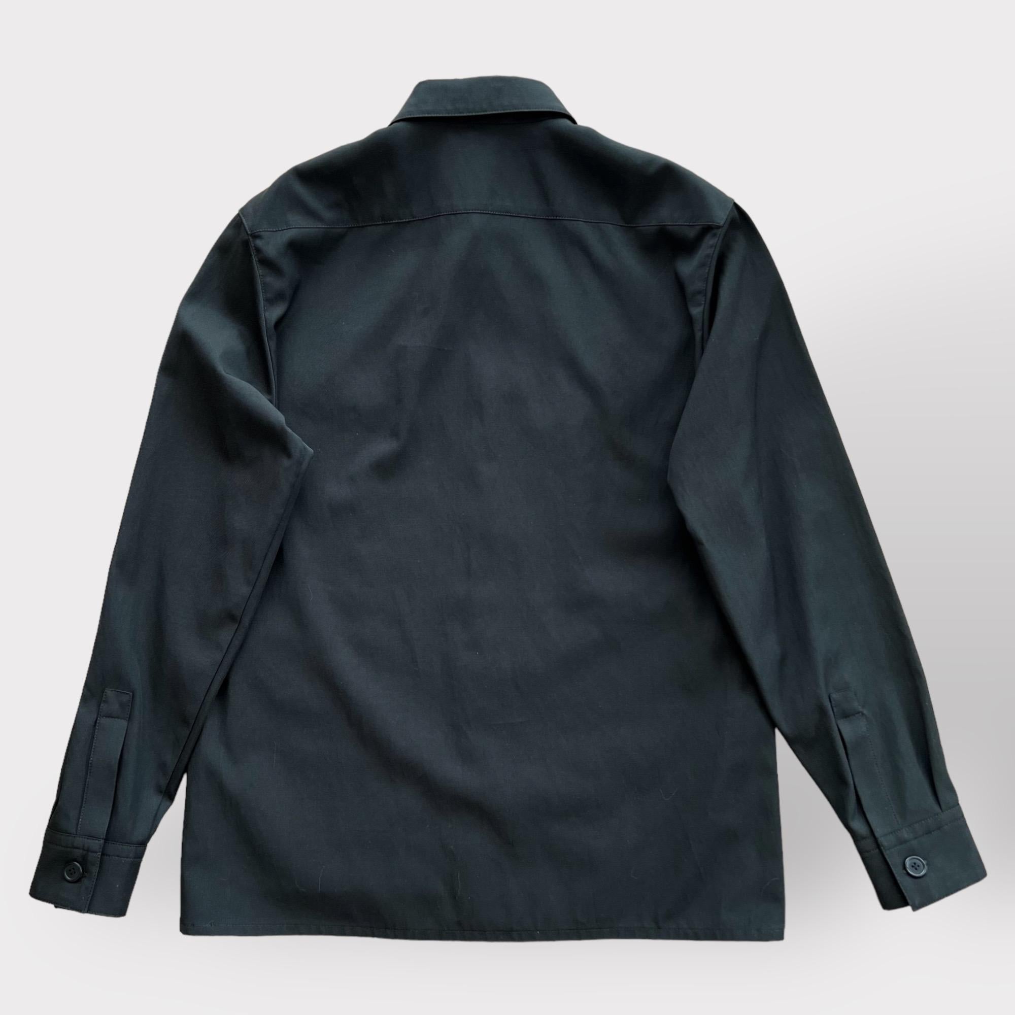 Shop this Men's 'Icones au Carre' Straight Cut Overshirt from the Hermes Spring / Summer 2023 collection. It comes in the classic black colour and features the new season 'Icones au Carre' detailing.

The jacket is made from 54% Viscose and 46%