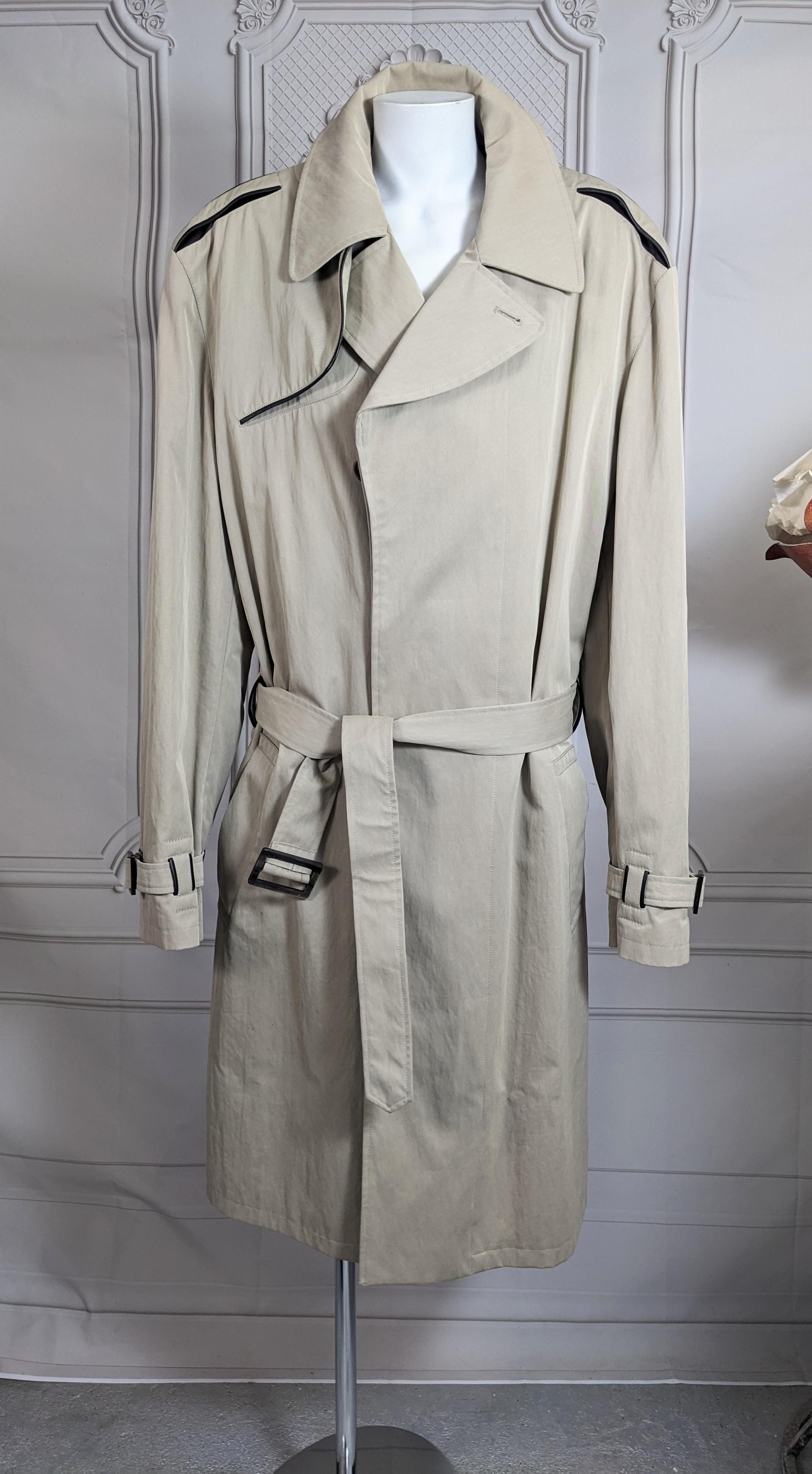 Elegant Hermes Mens Leather Trimmed Trench from the 2000's. Classic cut with interesting details reminiscent of Margiela's tenure at the house. Each detail is extremely well thought out and subtle. 
All the classic elements of the trench are trimmed