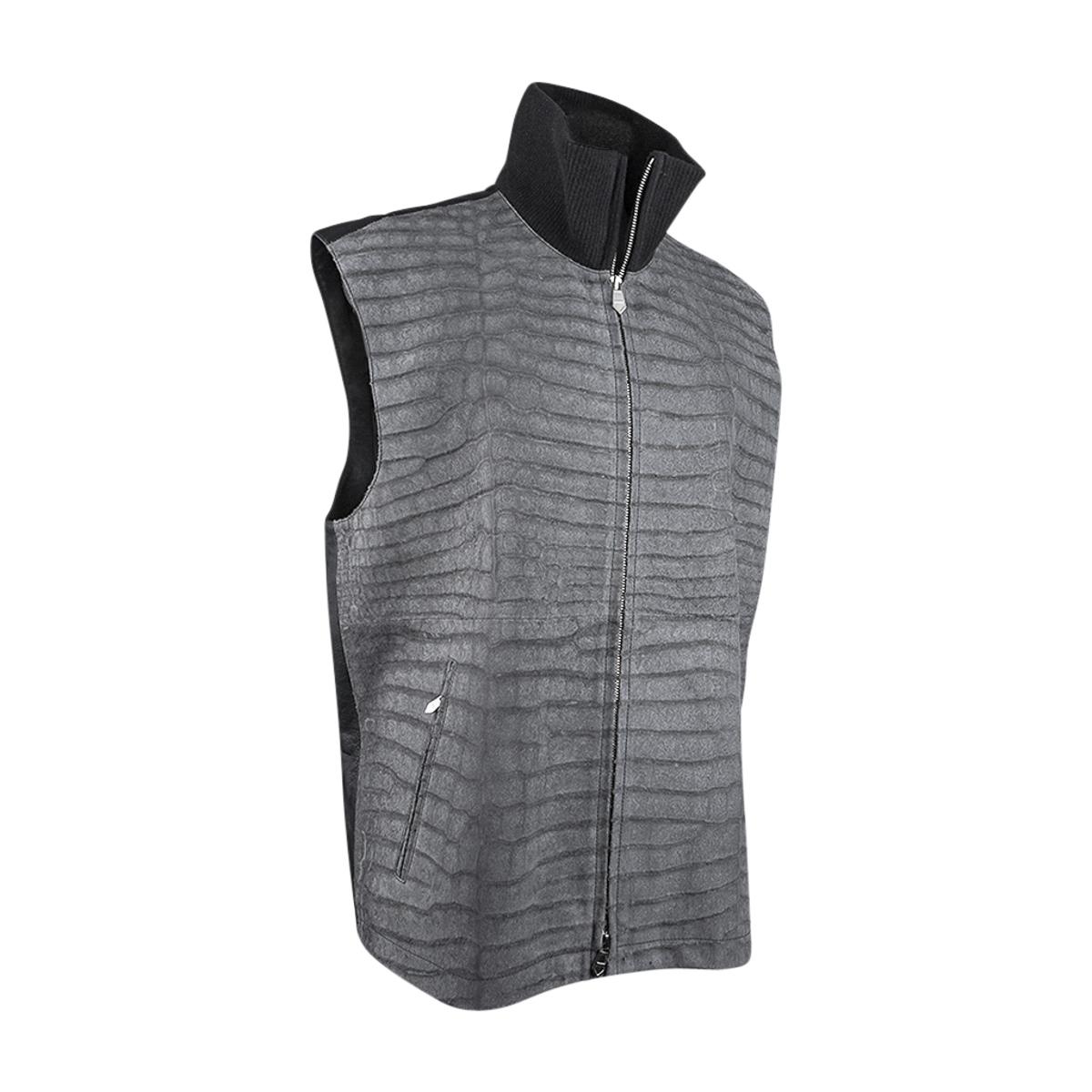 Mightychic offers an Hermes Men's vest featured in grey sueded porosus Crocodile.
This very rare and limited edition Hermes vest has a zip closure with two angled zip pockets with 
palladium pulls.
Front is rich sueded porosus and the rear is grey