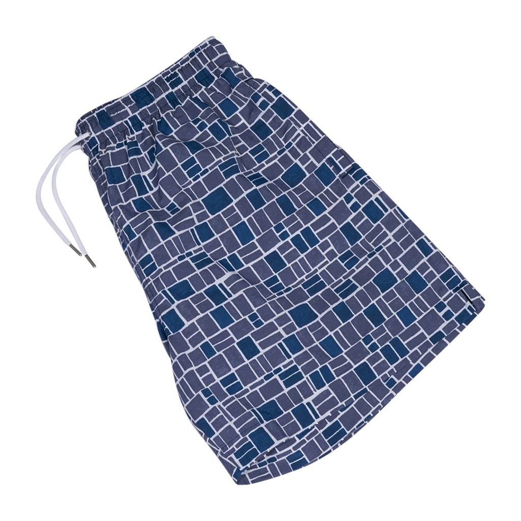 Hermes limited edition Men's Swim Trunks.
Blue, Grey, and White Mosaique H print.
Elastic waist and silver metal tipped white drawstring.
2 front pockets and 1 rear pocket with Clou de Selle snap.
Lined in white.
Fabric is nylon; lining is nylon and