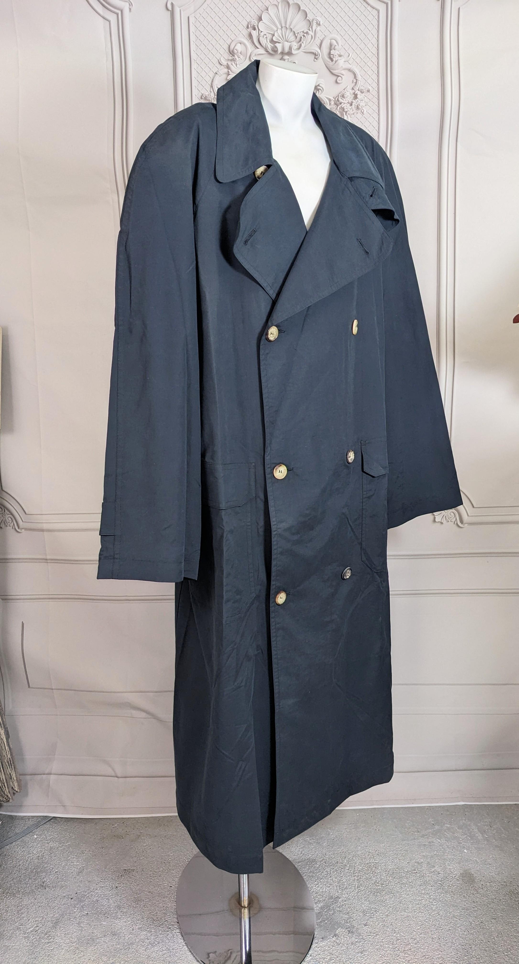 Hermes Mens Navy Oversized Trench from the 2000's of lightweight water repellant poplin suitable for 3 season use. Cut as a full double breasted trench with raglan sleeves and patch pockets. Incredible detailing with Hermes Logo Horn buttons