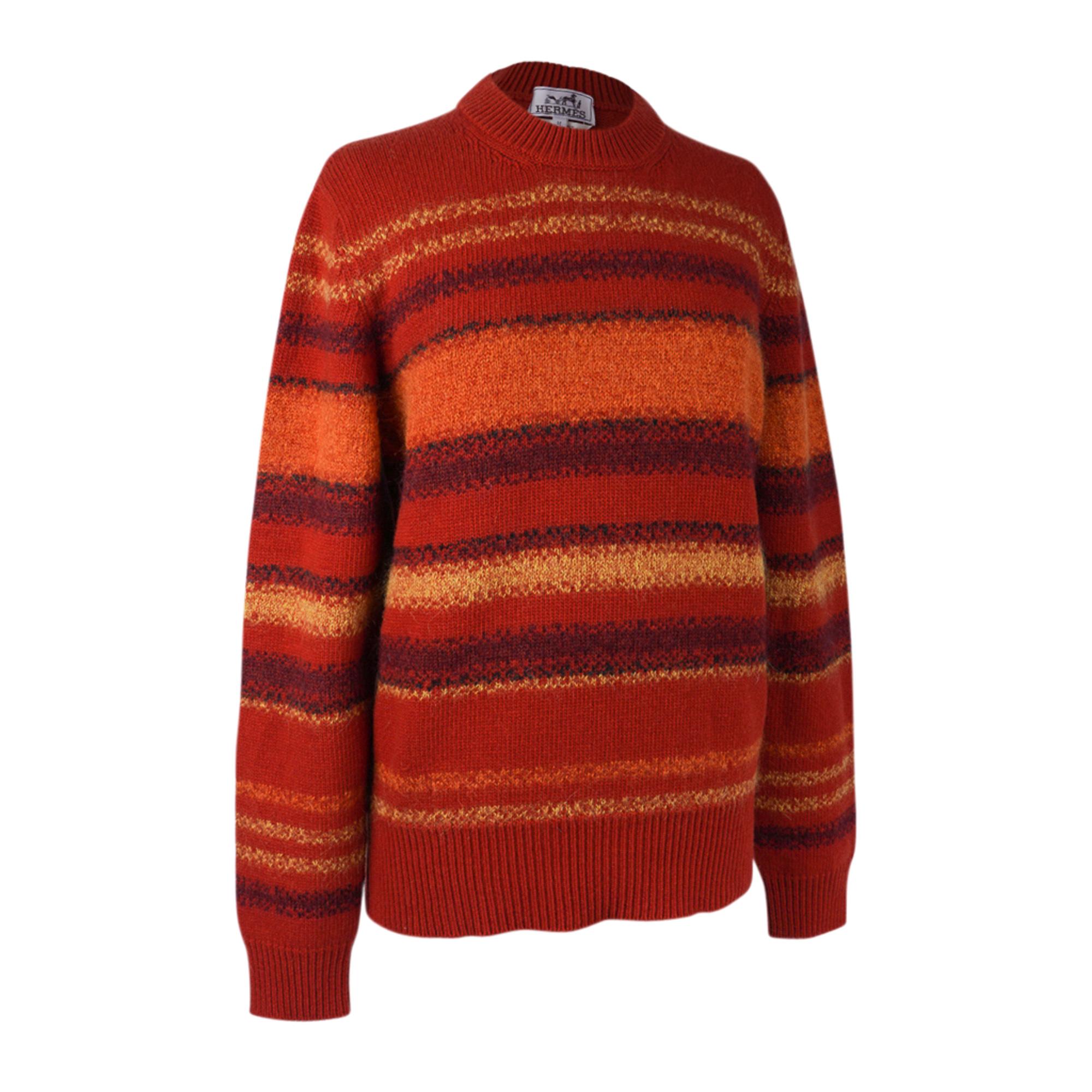 Mightychic offers an Hermes Men's Rayures Fondues (melted stripes) crewneck sweater featured in Orange Brulee.
Rich warm toned hues will compliment a myriad of  warbrobes.
Sweater has Linear pattern all around.
Ribbing at cuffs, hip and neck.
Fabric
