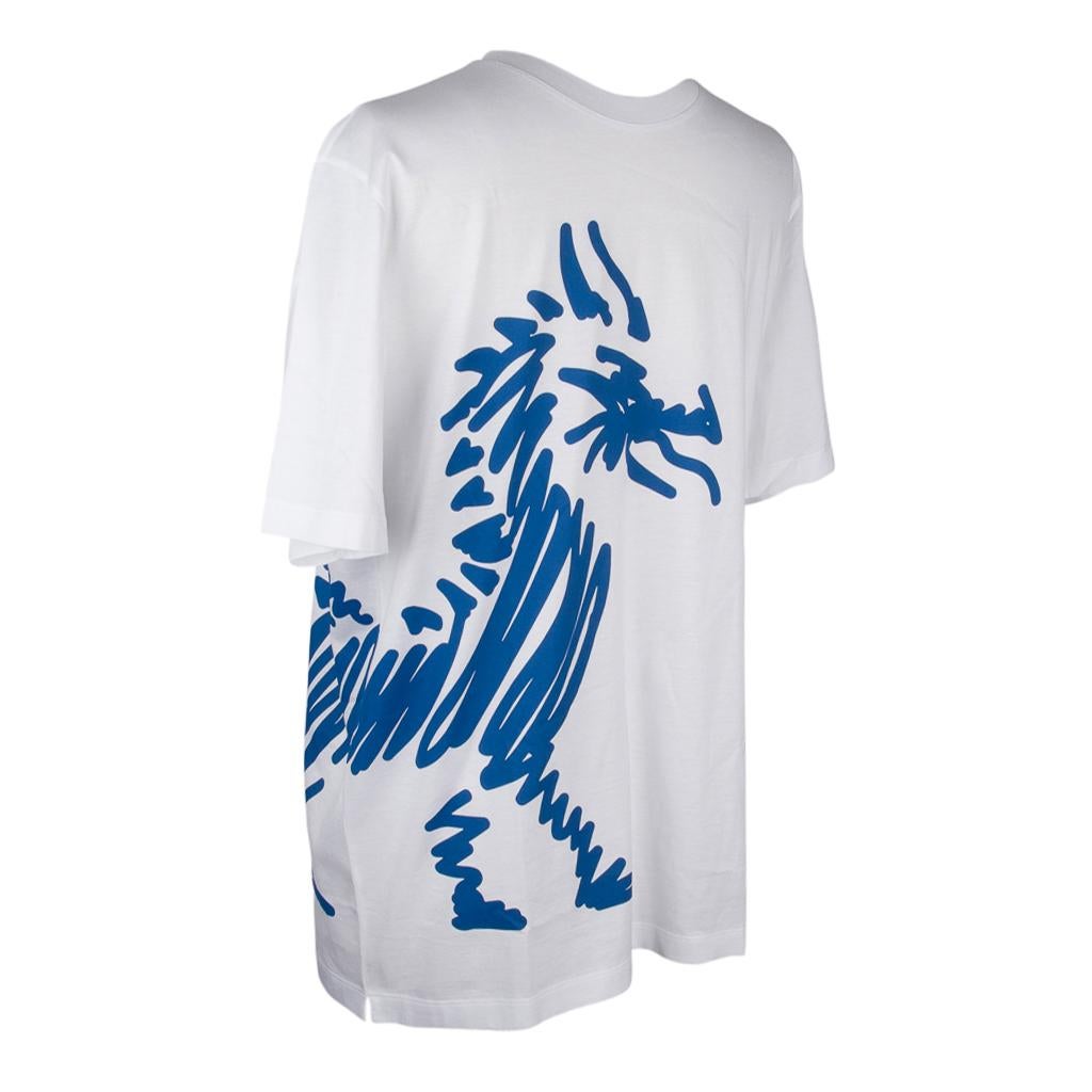 Mightychic offers an Hermes Dragon T-Shirt in White and Blue.
Graphic Tee depicting abstract dragon in blue.
Short sleeve T with crew neck. 
Fabric is cotton jersey. 
Comes with signature Hermes box and ribbon. 
NEW or NEVER WORN.  
Final Sale    