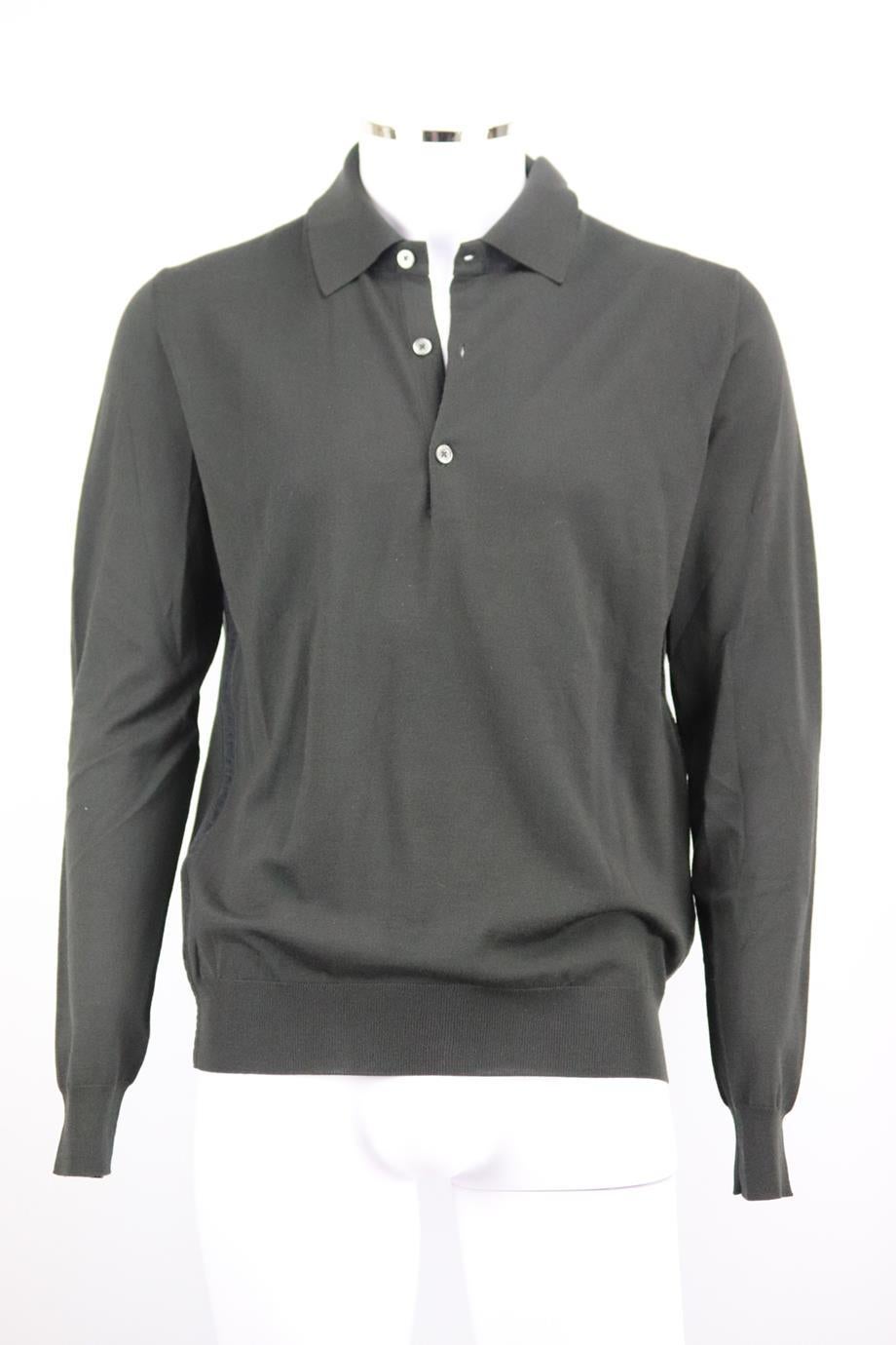 Hermès men's wool polo shirt. Black. Long sleeve, v-neck. Slips on. 100% Wool; fabric2: 100% cotton. Size: Large (IT 50, UK/US Chest 40, UK/US Collar 16). Shoulder to shoulder: 18 in. Chest: 42 in. Waist: 40 in. Hips: 36 in. Length: 27 in. Sleeve