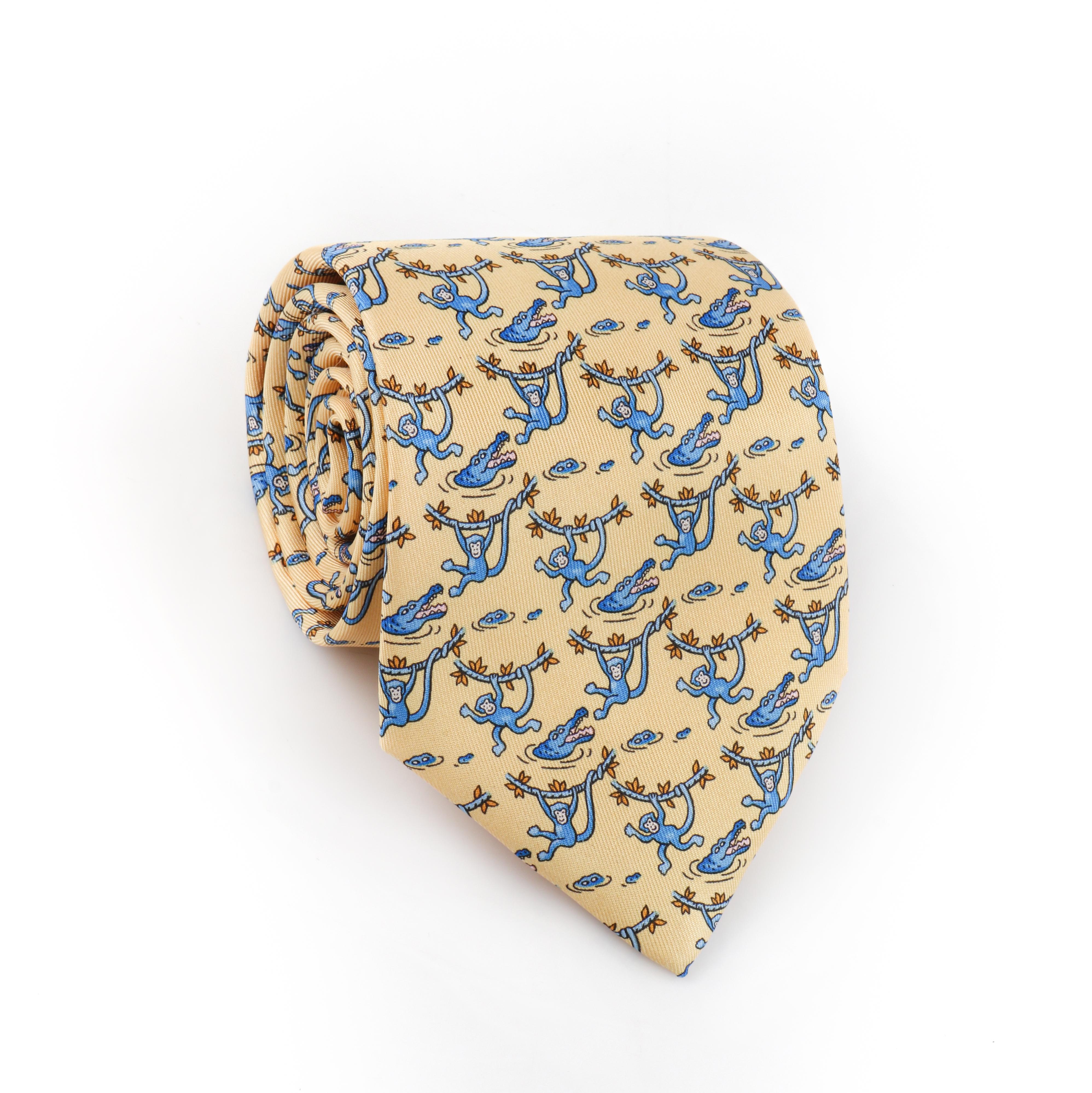 HERMES Men’s Yellow Blue Monkey Crocodile 5-Fold Silk Necktie Tie 7682 TA w/Tags
 
Brand/Manufacturer: Hermes
Style: 5-Fold necktie
Color(s): Shades of yellow, blue, orange, black, white
Lined: Yes
Marked Fabric Content: “100% Silk”  
Additional