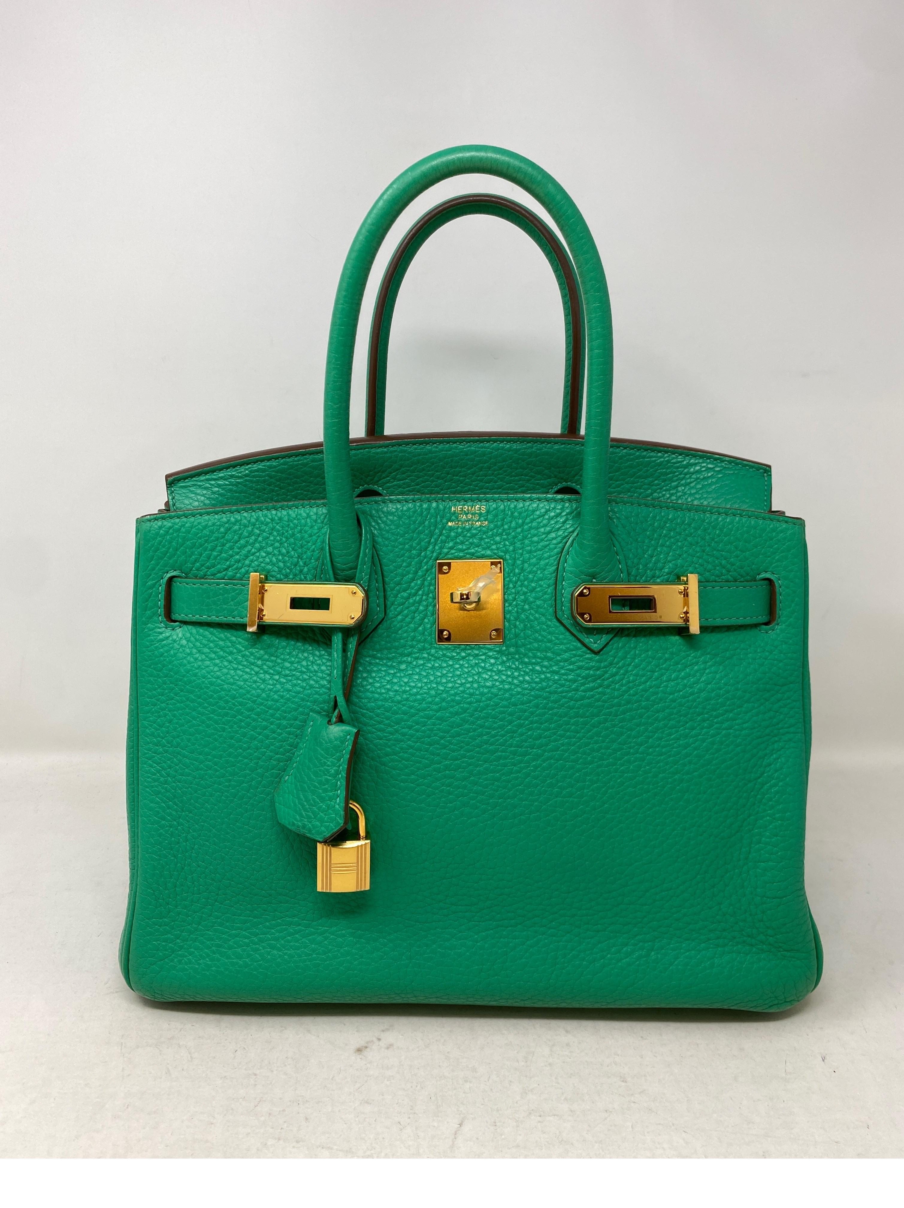 Hermes Menthe Birkin 30 Bag. Minty green color with gold hardware. Clemence leather. Interior clean. Exterior excellent condition. Plastic is still on hardware. Includes clochette, lock, keys, and dust bag. Guaranteed authentic. 