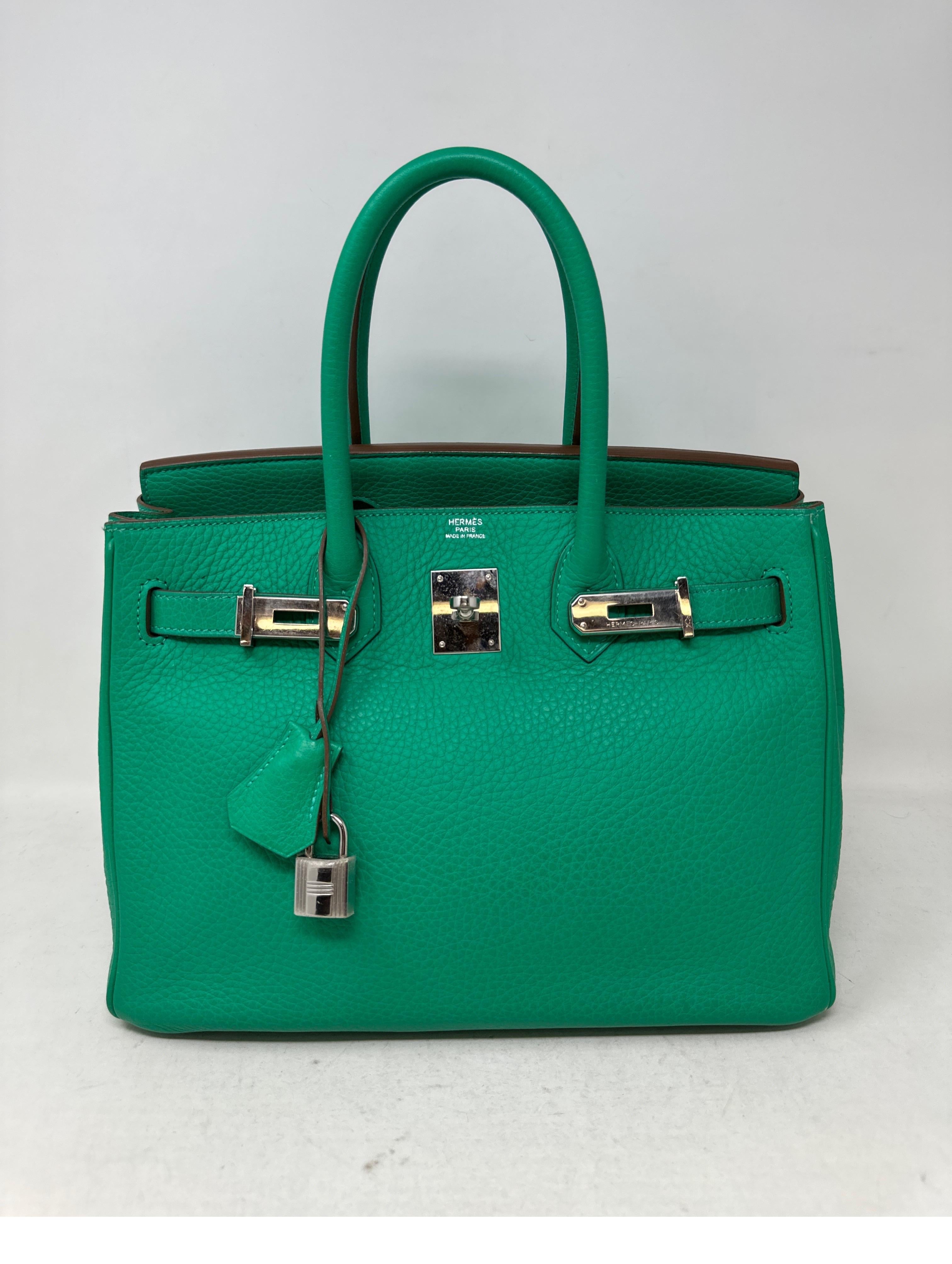 Hermes Menthe Birkin 30 Bag. Minty green color with palladium silver hardware. Very good condition. Plastic still on the hardware. Interior clean. Clemence leather. Most wanted size 30 and unique green color. Includes clochette, lock, keys, and dust
