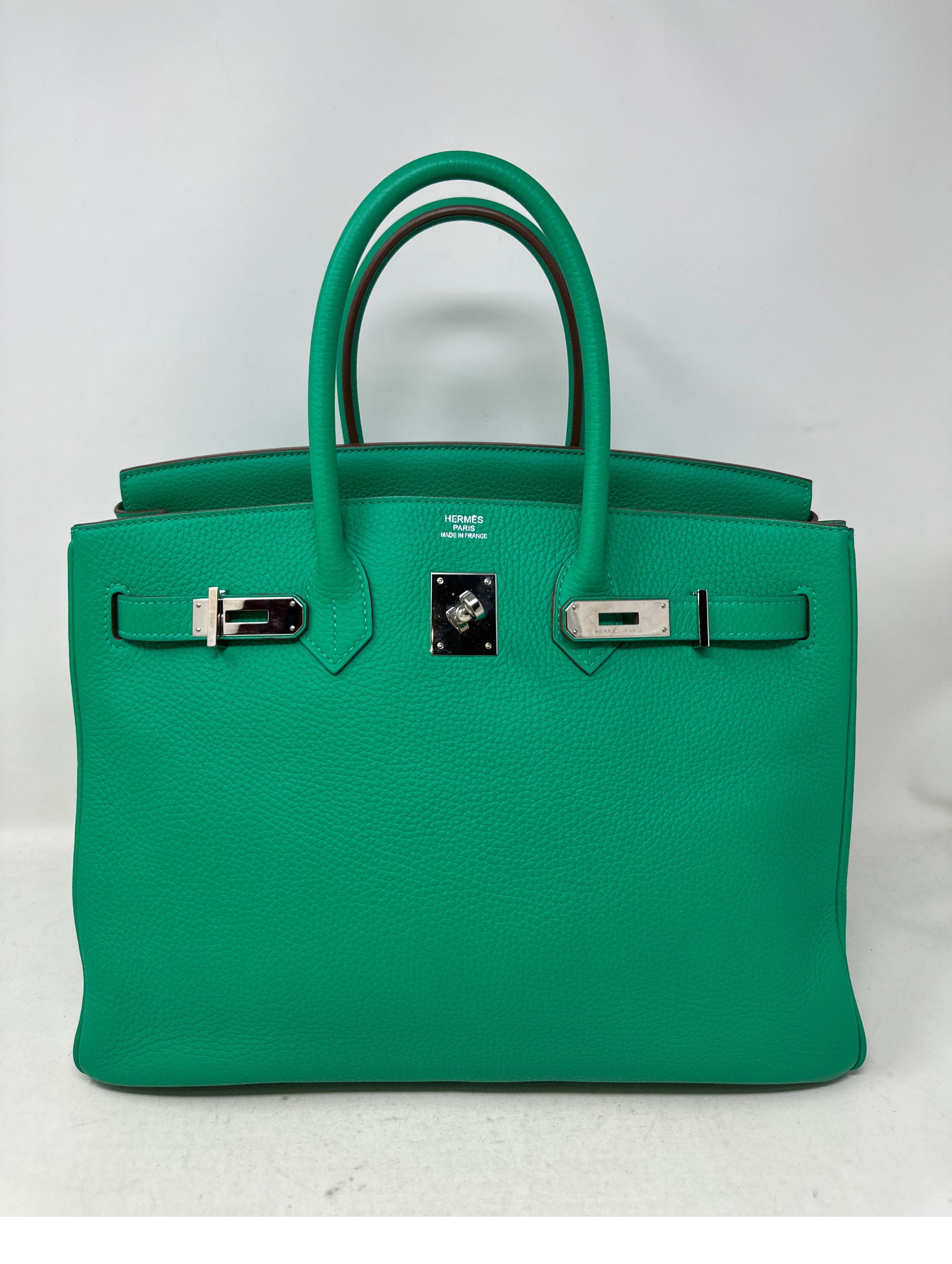 Hermes Menthe Green Birkin 35 Bag. Excellent condition. Clemence leather. Palladium silver hardware. Minty green color. Interior clean. Includes clcohette, lock, keys, and dust bag. Includes Bababebi authenticity certificate. Guaranteed authentic. 