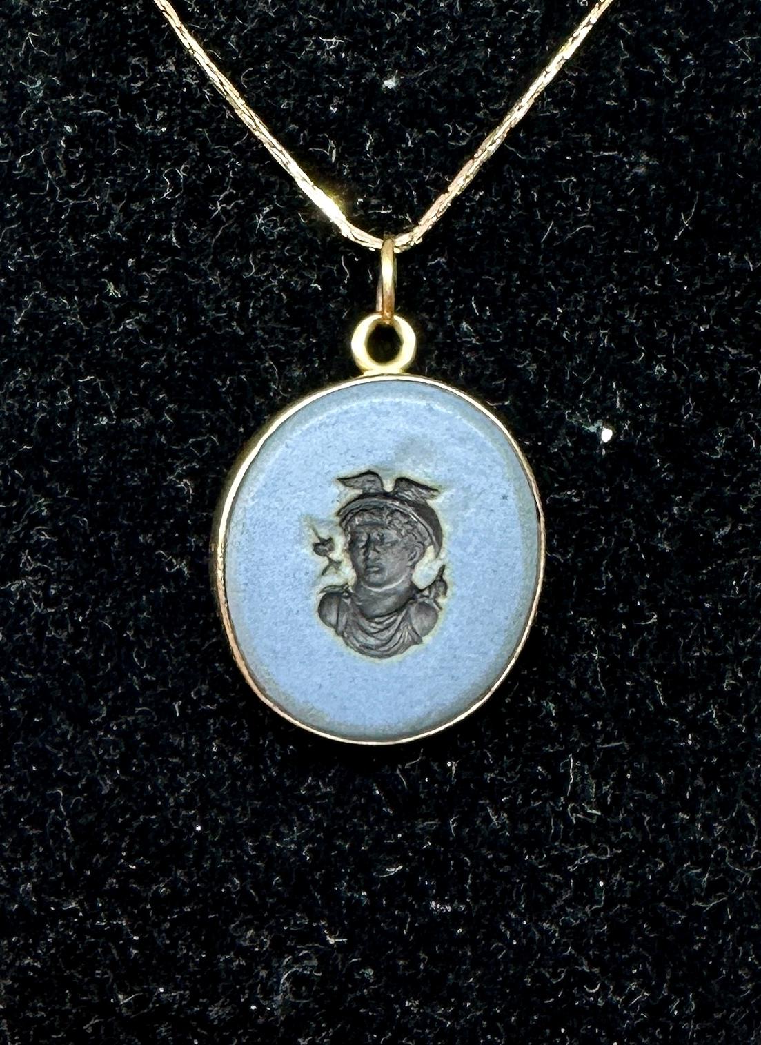 Indulge in a stunning antique Victorian Blue Jasper Cameo Intaglio Pendant or Charm with an image of the God Hermes or Mercury with his fabulous winged helmet and noble face.
The antique intaglio pendant is made of blue and black jasper porcelain in