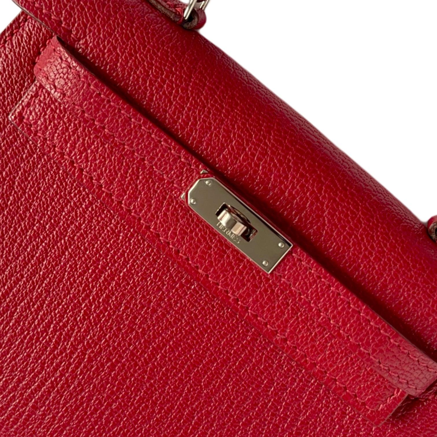 1stdibs Exclusive From Three Over Six

Brand: Hermès 
Style: Kelly Sellier
Size: Micro 15cm
Color: Rouge
Leather: Chèvre 
Hardware: Palladium
Stamp: N 2010

Vintage mint: The item is vintage but given its age is in impeccable condition. There may be