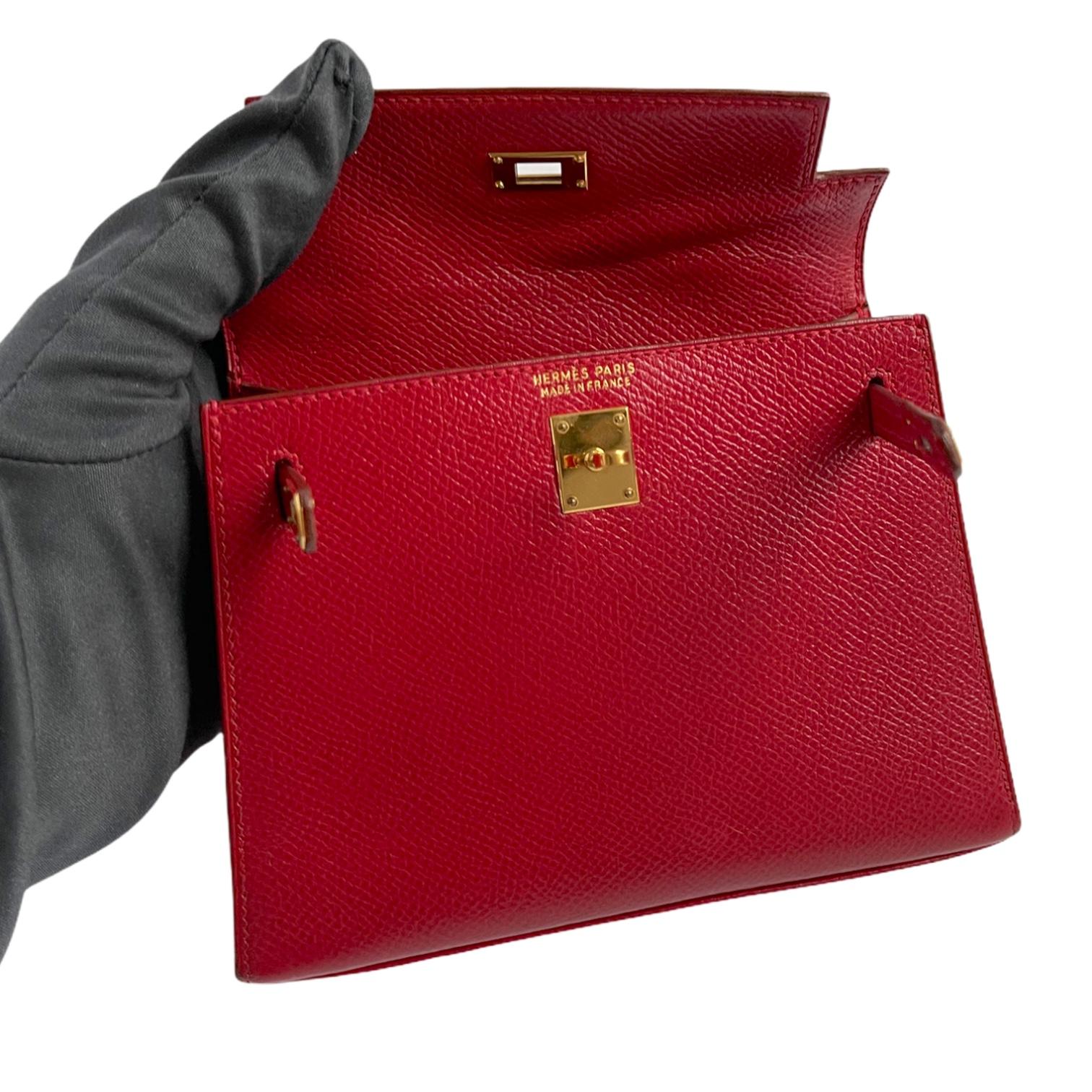 1stdibs Exclusives from Three Over Six

Brand: Hermès 
Style: Kelly Sellier
Size: Micro 15cm
Color: Rouge
Leather: Courchevel 
Hardware: Gold
Stamp: N 1993

Vintage excellent: This item is vintage and shows natural signs of ageing. This item will