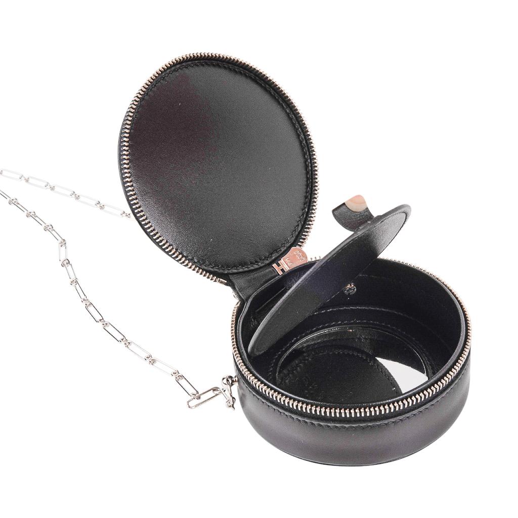 Mightychic offers an Hermes Rond Micro Sac features Black Veau Villandry leather.
Has small hidden mirror inside!
Palladium Paper Clip Chain can be carried by hand or as a shoulder bag.
Has a zip around closure.
One of a three miniature model