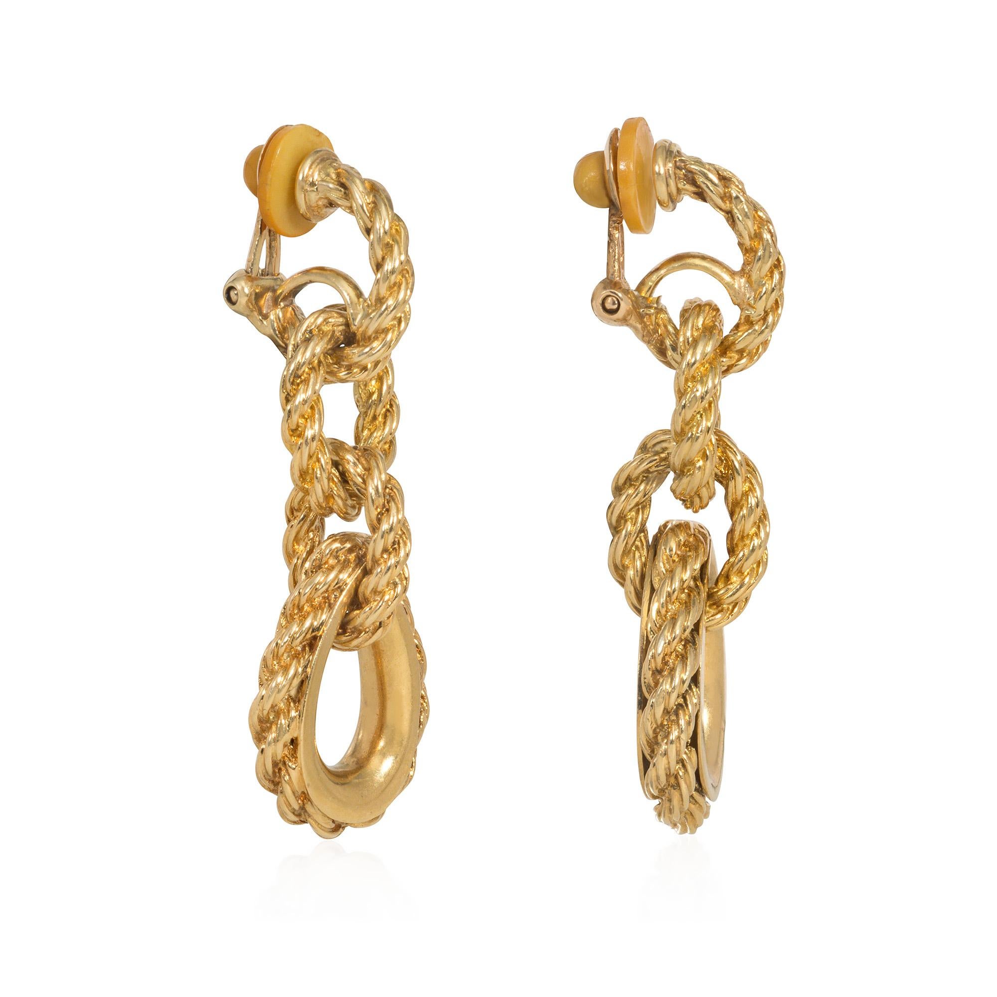 A pair of mid-century ropetwist gold earrings comprised of three oval links terminating in a drop-shape pendant, in 18k with clip backs.  Hermès, Paris.

* Includes letter of authenticity for insurance purposes
* Free shipping
* Please do not