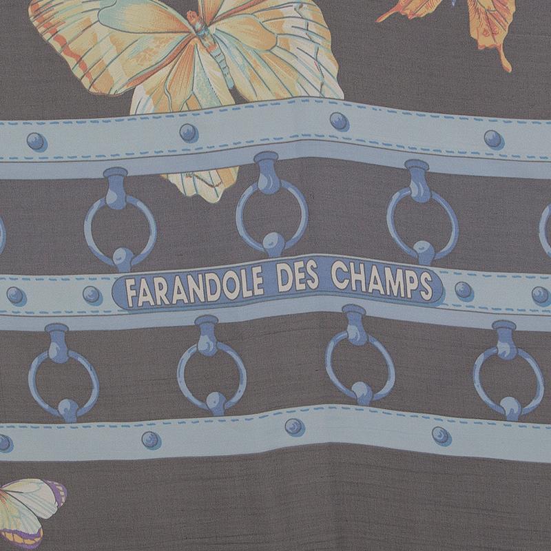 Hermes 'Farandole des Champs 140 Mousseline' scarf in midnight blue, black, raspberry red, light blue, yellow, rose, green, purple and turquoise silk mousseline (chiffon 100%). Has been worn and is in excellent condition.

Width 140cm